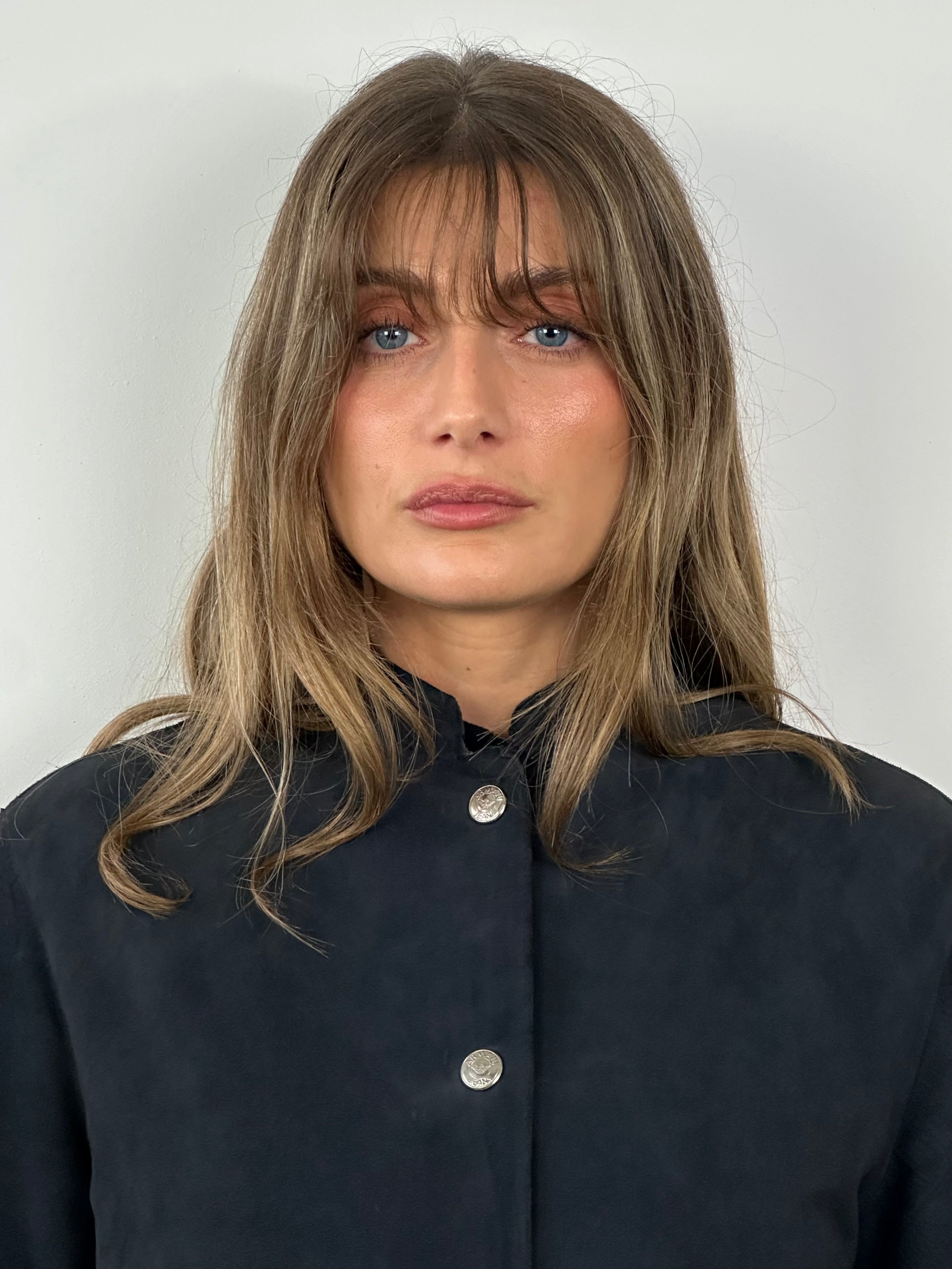 Armani Jeans fitted suede jacket in medium size, featuring a stylish design and classic detailing, displayed on a hanger.