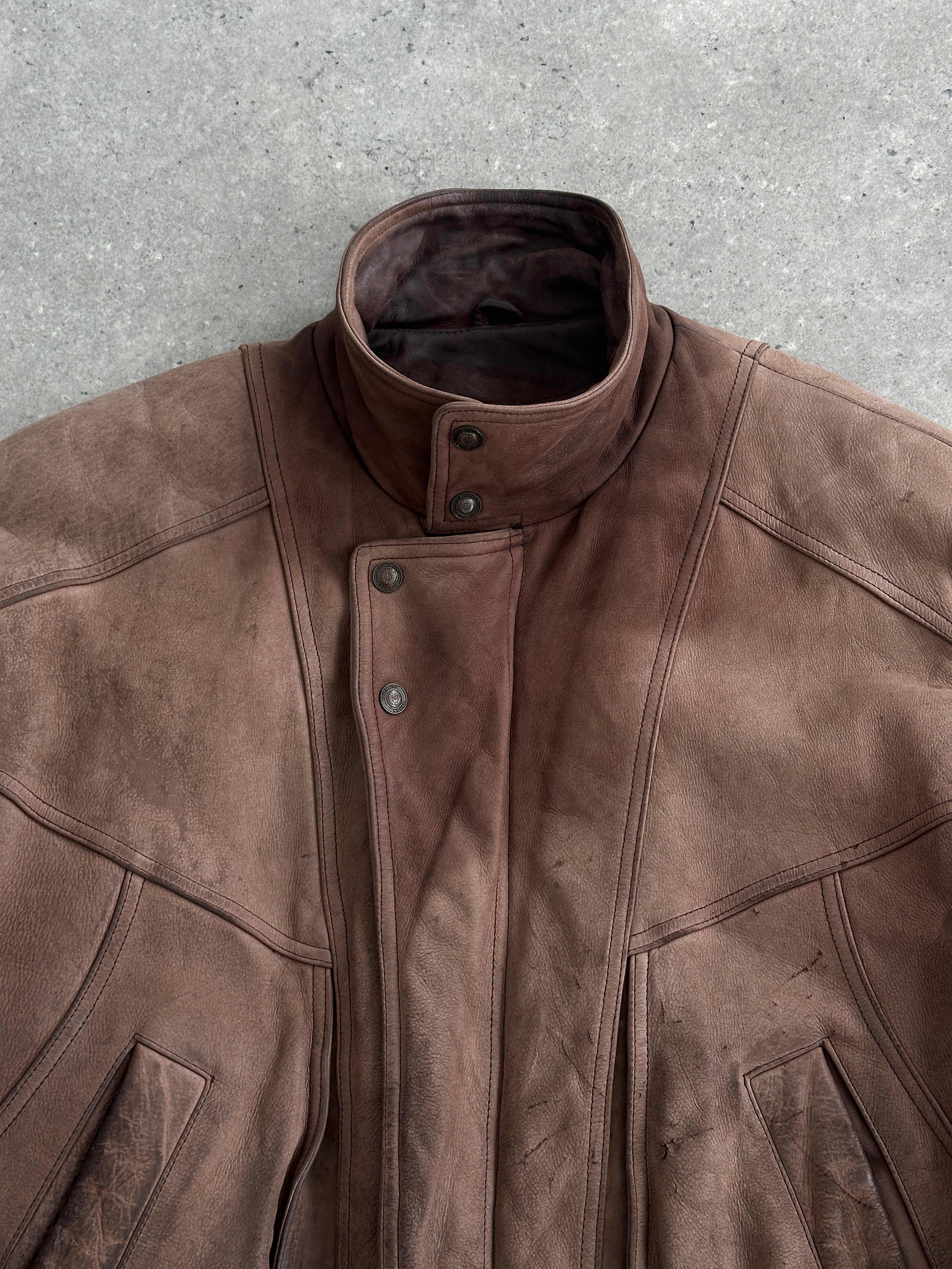 Vintage 1990s high-neck leather bomber jacket in aged brown leather, size large, with classic vintage style and sturdy construction.
