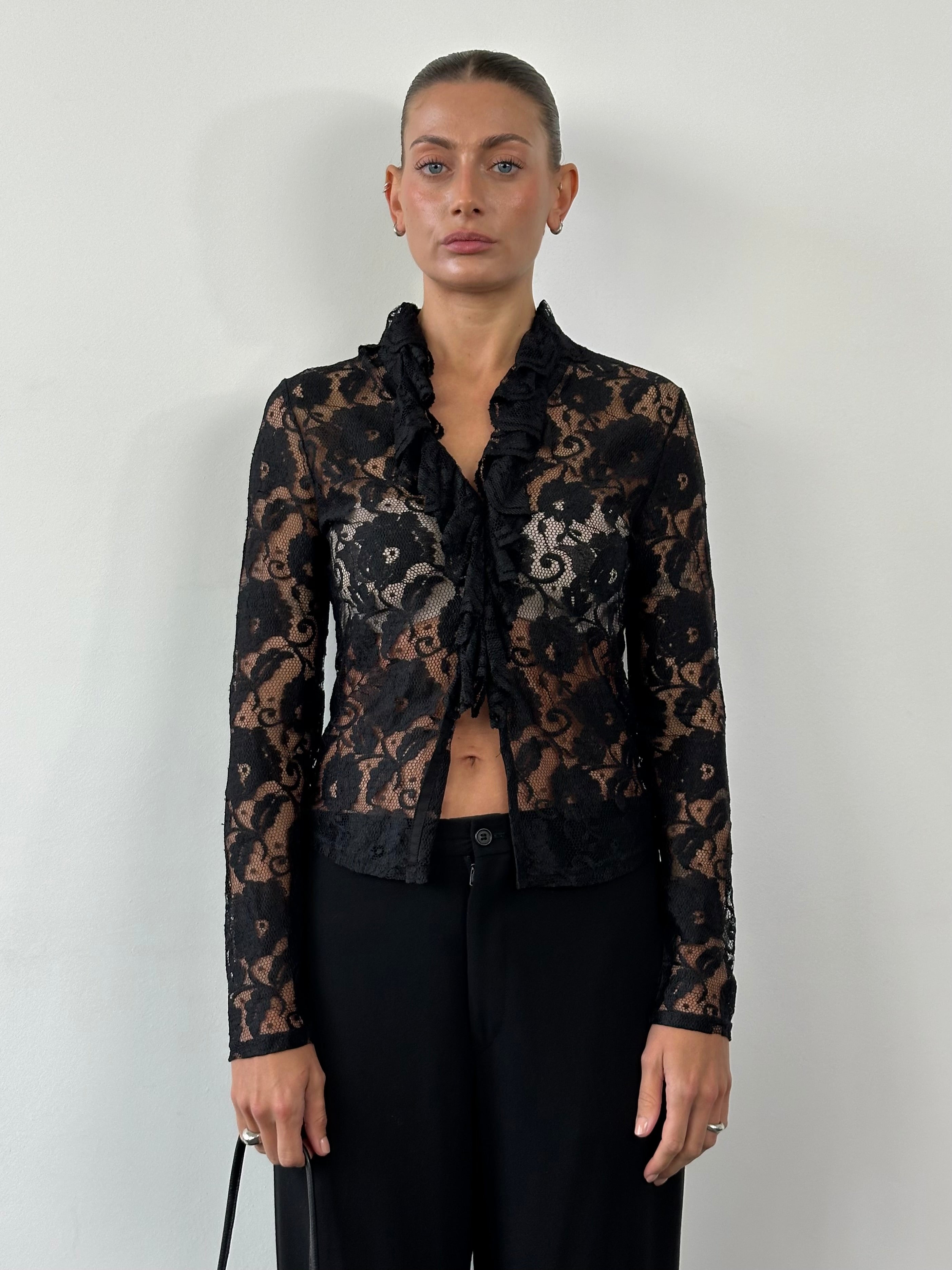 Vintage lace ruffled shirt in size small/medium, featuring delicate lace details and feminine ruffle accents.
