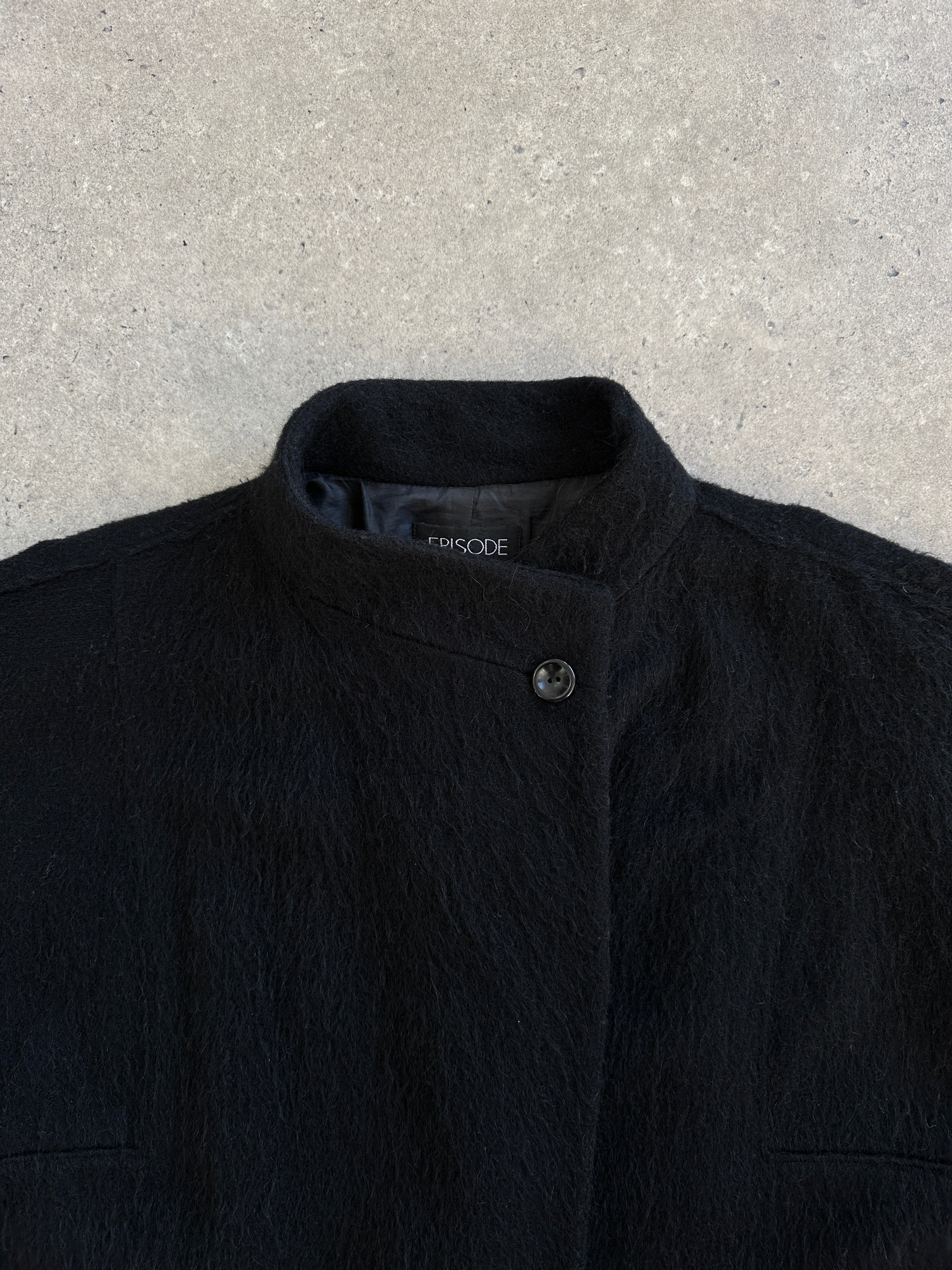 Vintage 1990s wool mohair high neck coat, size M, featuring a classic high collar and textured fabric in a vintage style.