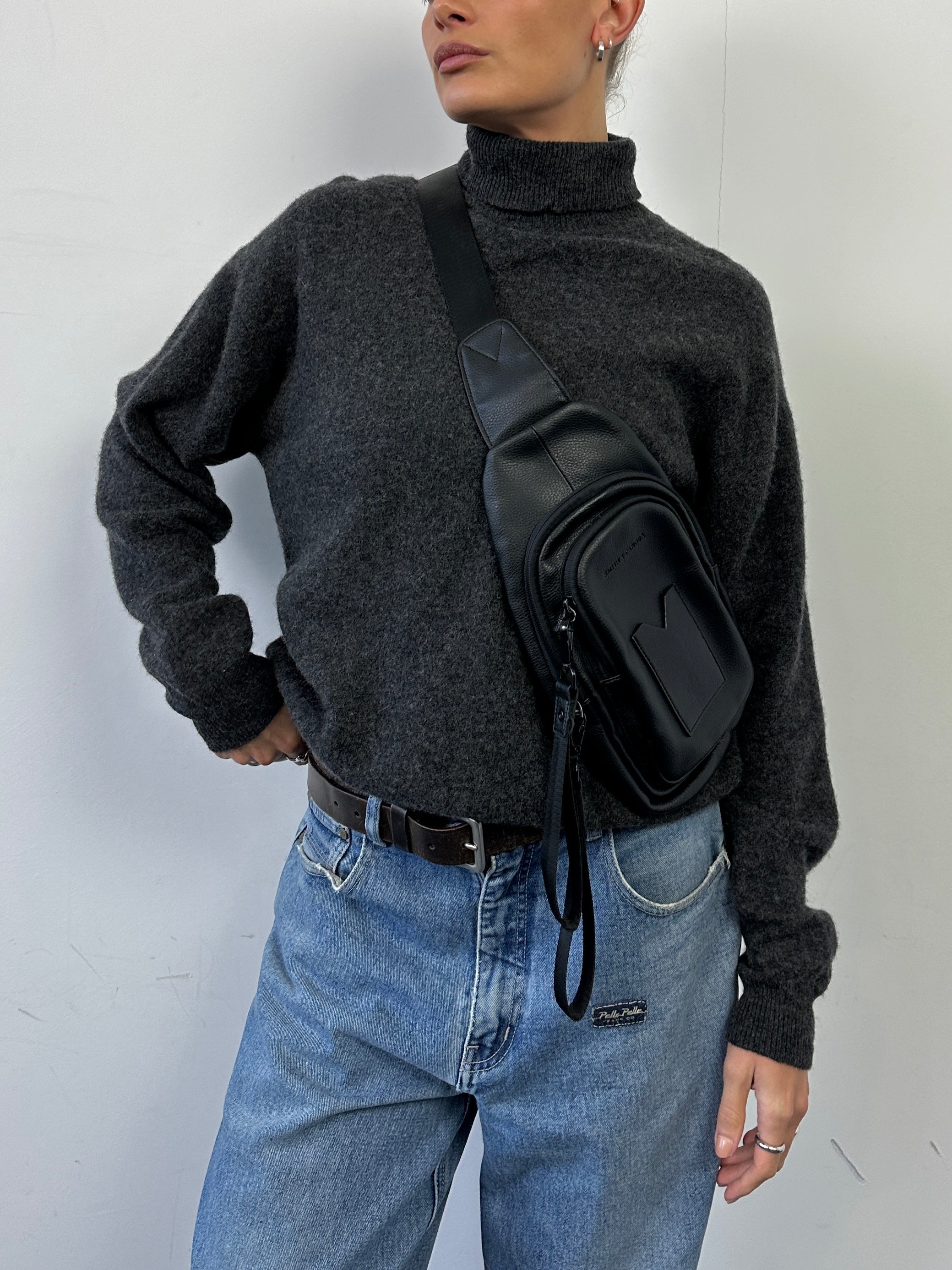 Lacoste pure wool roll neck jumper in charcoal gray, men's size M, featuring a classic ribbed collar and smooth knit fabric.