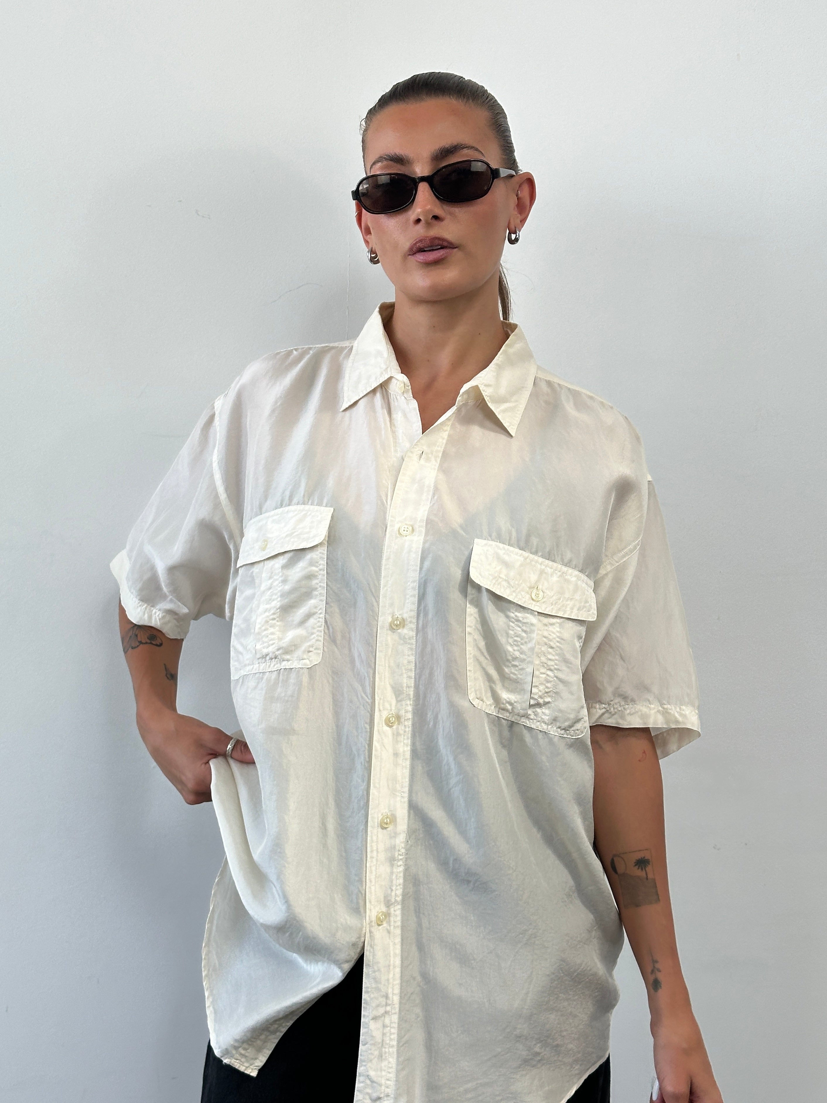 Vintage pure silk short sleeve shirt in XL with a classic design, soft texture, and smooth fabric visible in the image.