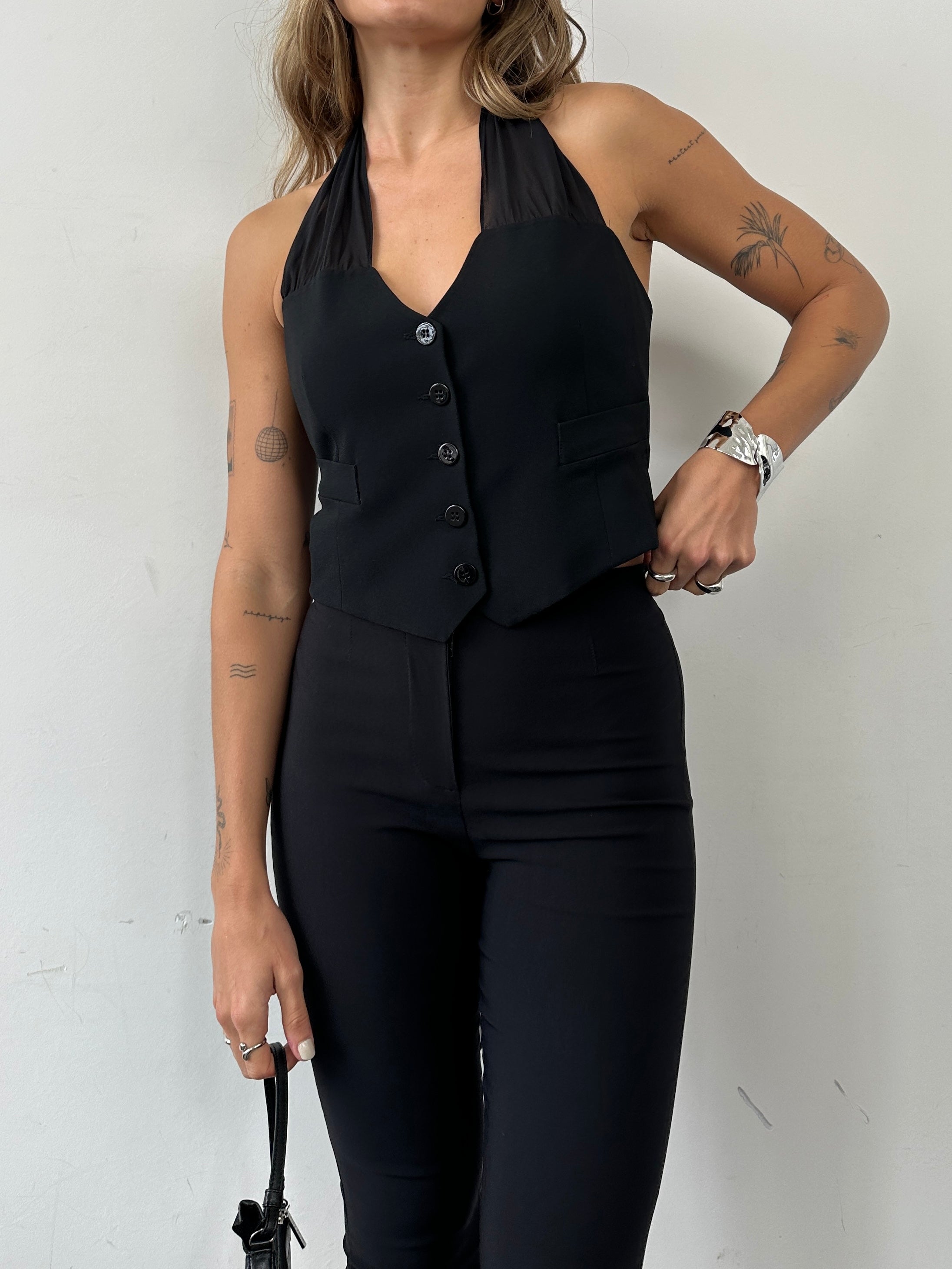 Emporio Armani 2002 pure silk halter neck waistcoat in sleek design, displayed on a hanger with a neutral background.