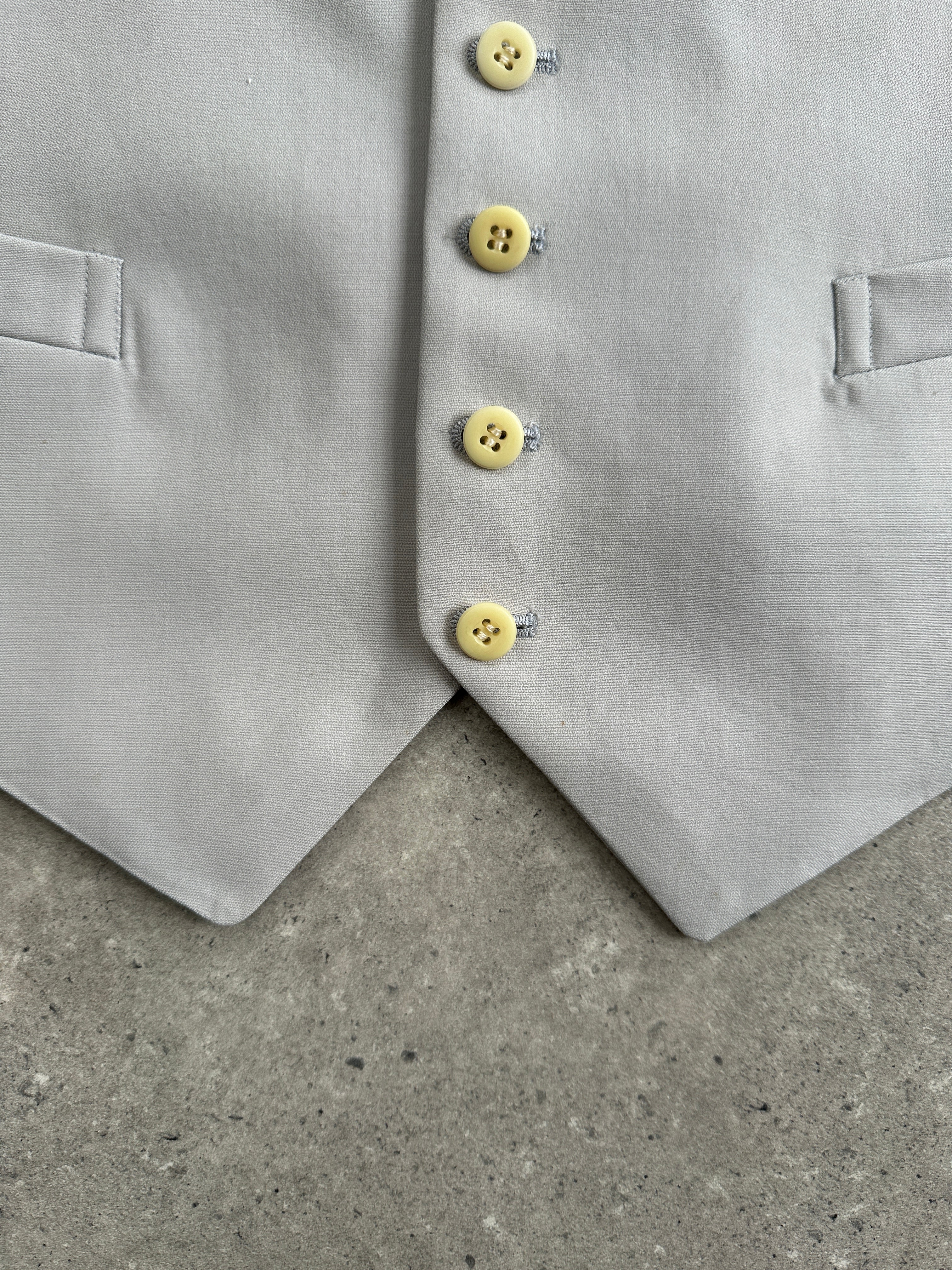 Vintage pure wool tailored waistcoat in size M/L, featuring a classic design with button closure and subtle textured fabric.