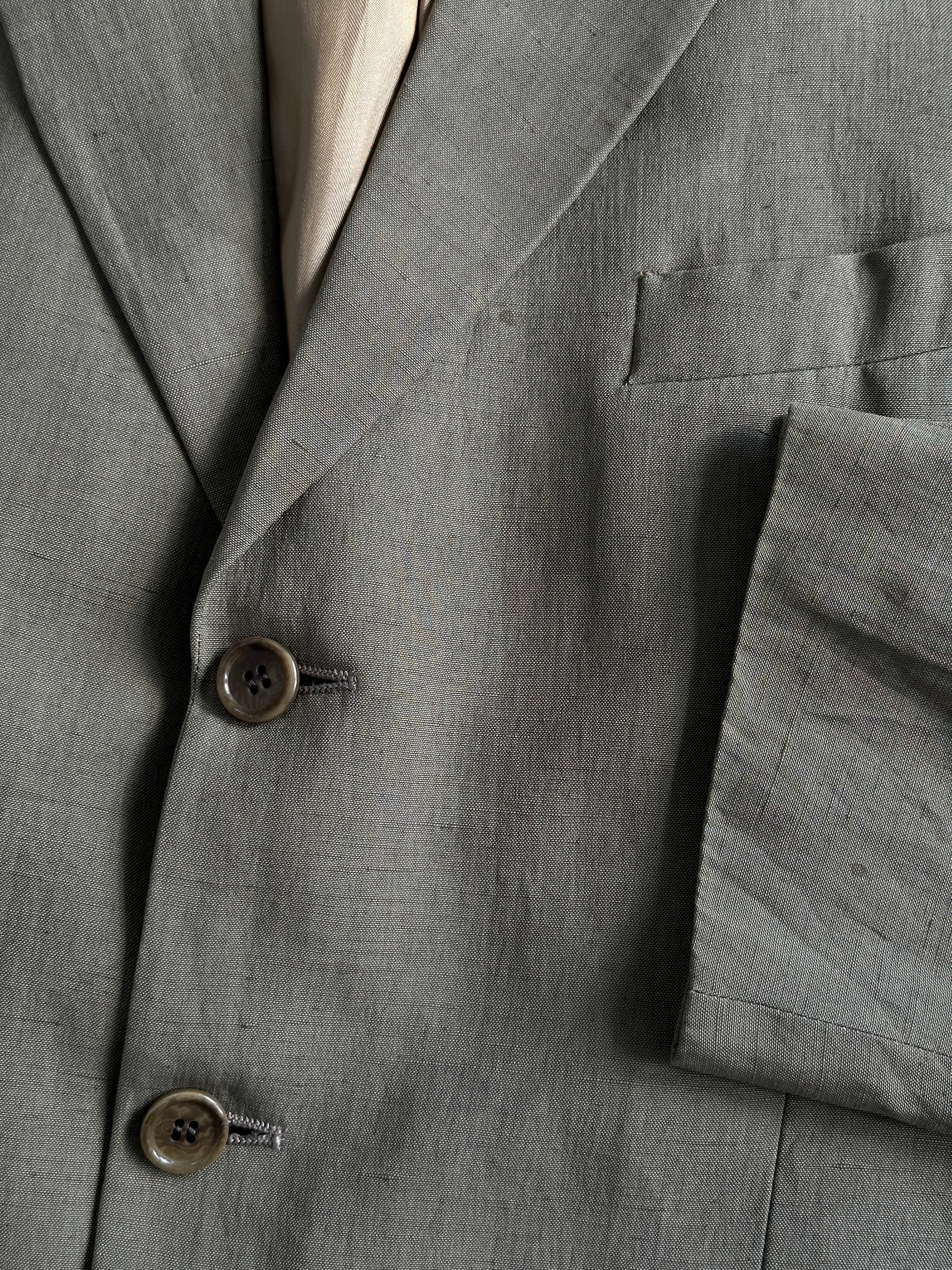 Jaeger silk linen single-breasted blazer in size 40R/L, tailored fit, with notch lapel and front buttons, displayed on a hanger.