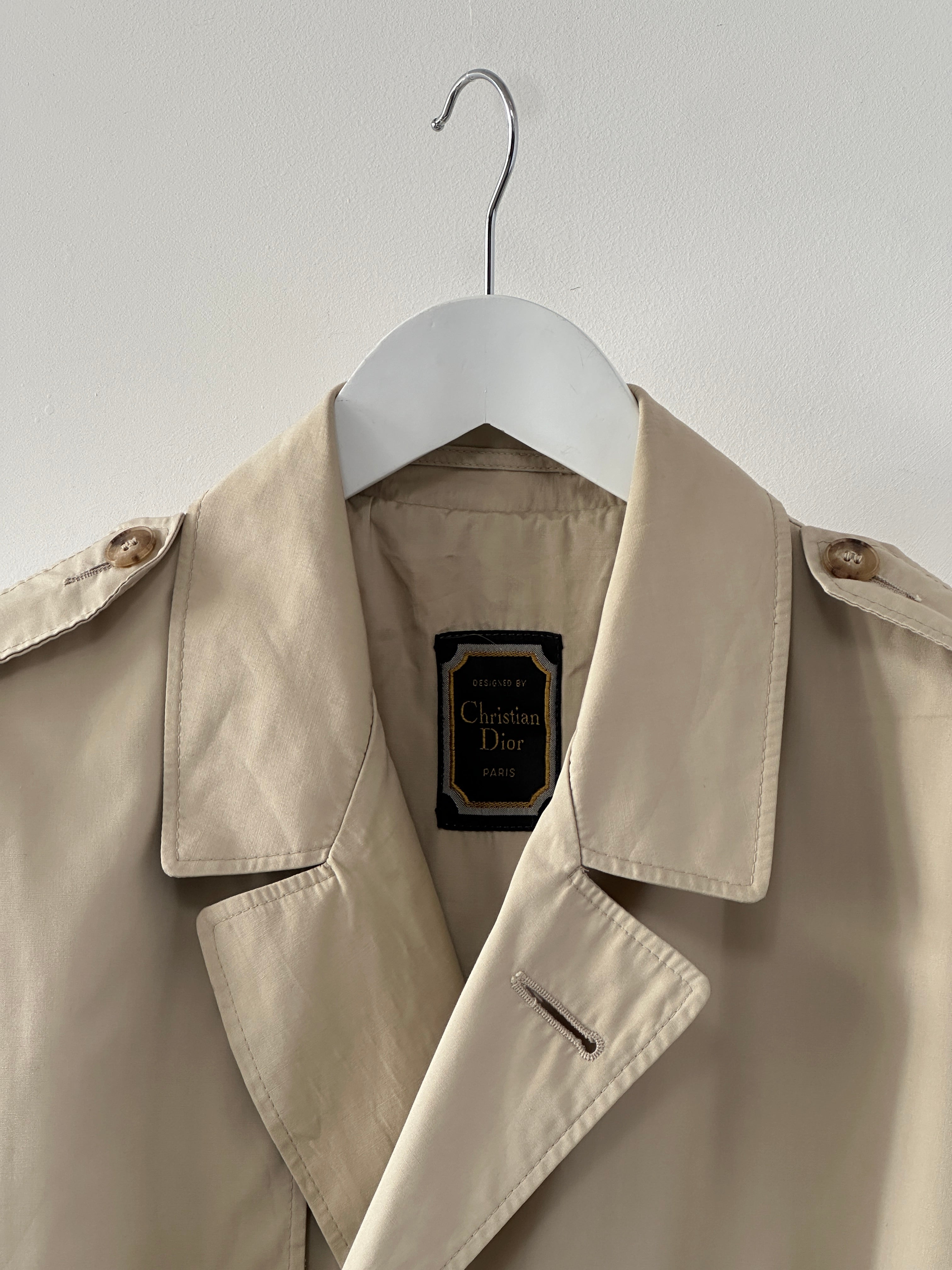 Christian Dior Paris cotton double-breasted belted trench coat in beige, size 40R/XL, displayed on a hanger.