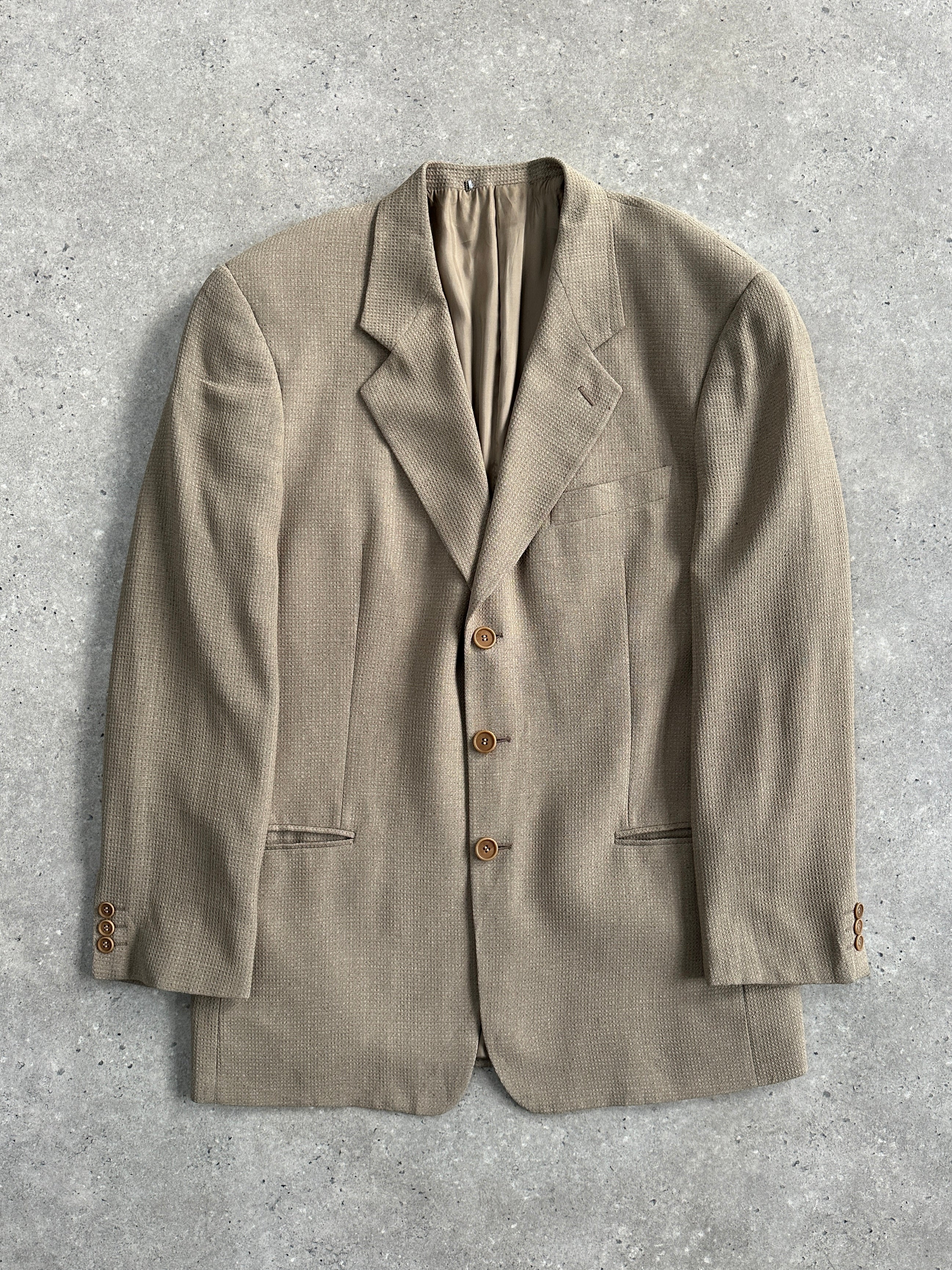 Giorgio Armani Le Collezioni 1990s wool woven blazer in size 40R/L, featuring classic tailored design and textured fabric.