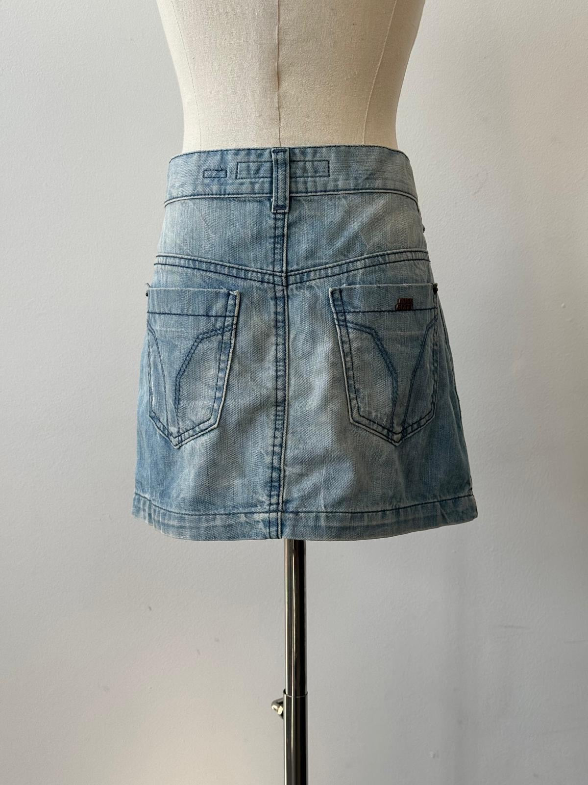 Miss Sixty 2000s denim mini skirt in W30, featuring classic blue wash and fitted waistband, displayed on a plain background.
