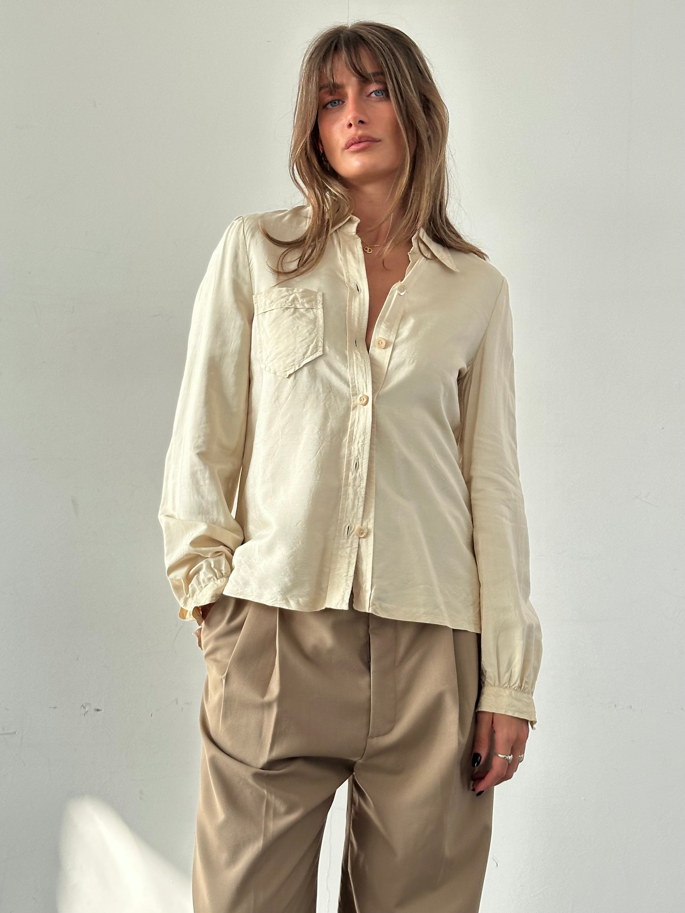 Vintage silk button-up shirt in size small, featuring a classic design with a smooth, elegant fabric and tailored fit.
