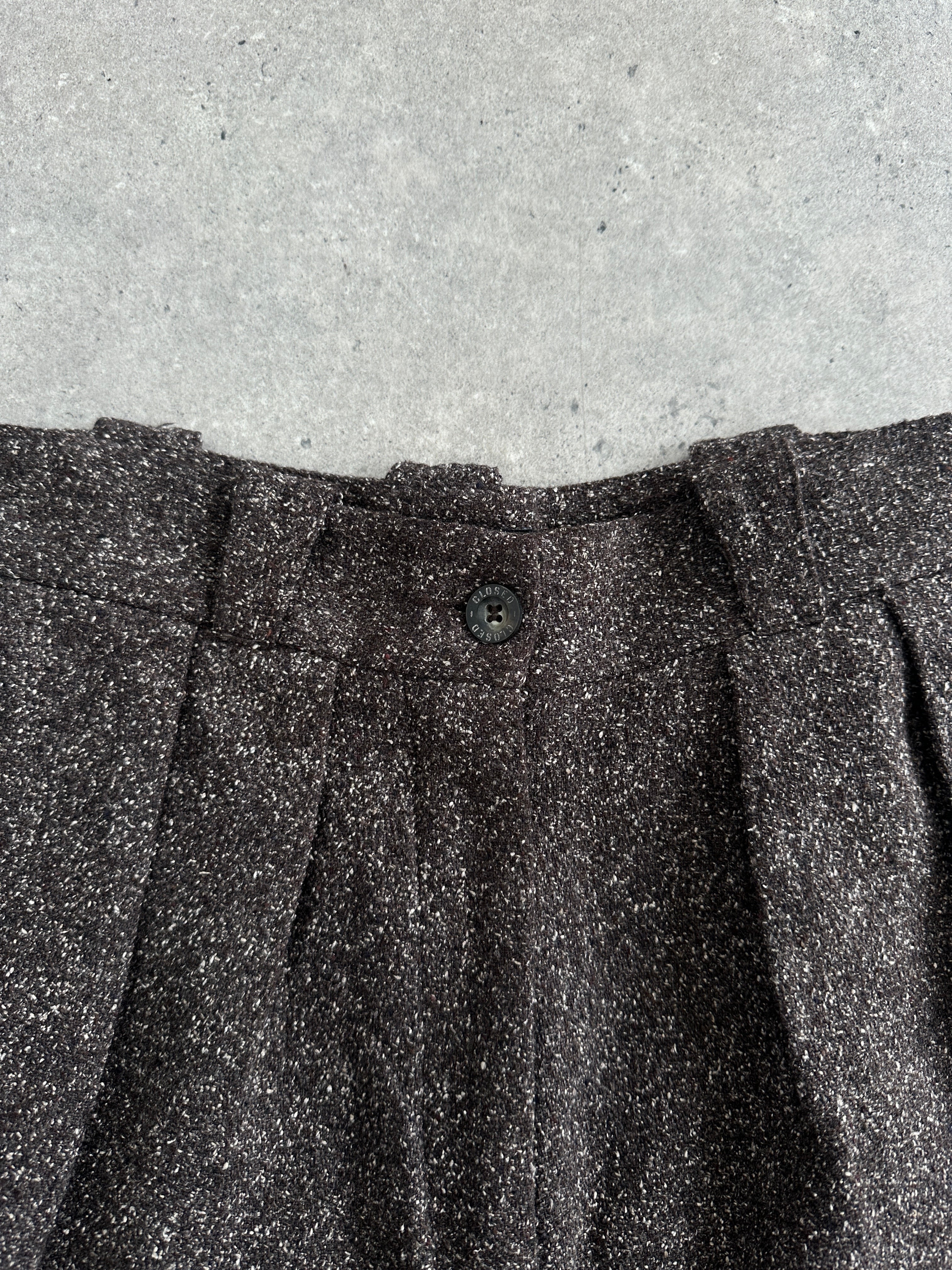 Vintage 1990s high-waisted wide-leg trousers in W24, showcasing classic denim style with a relaxed fit and wide leg silhouette.