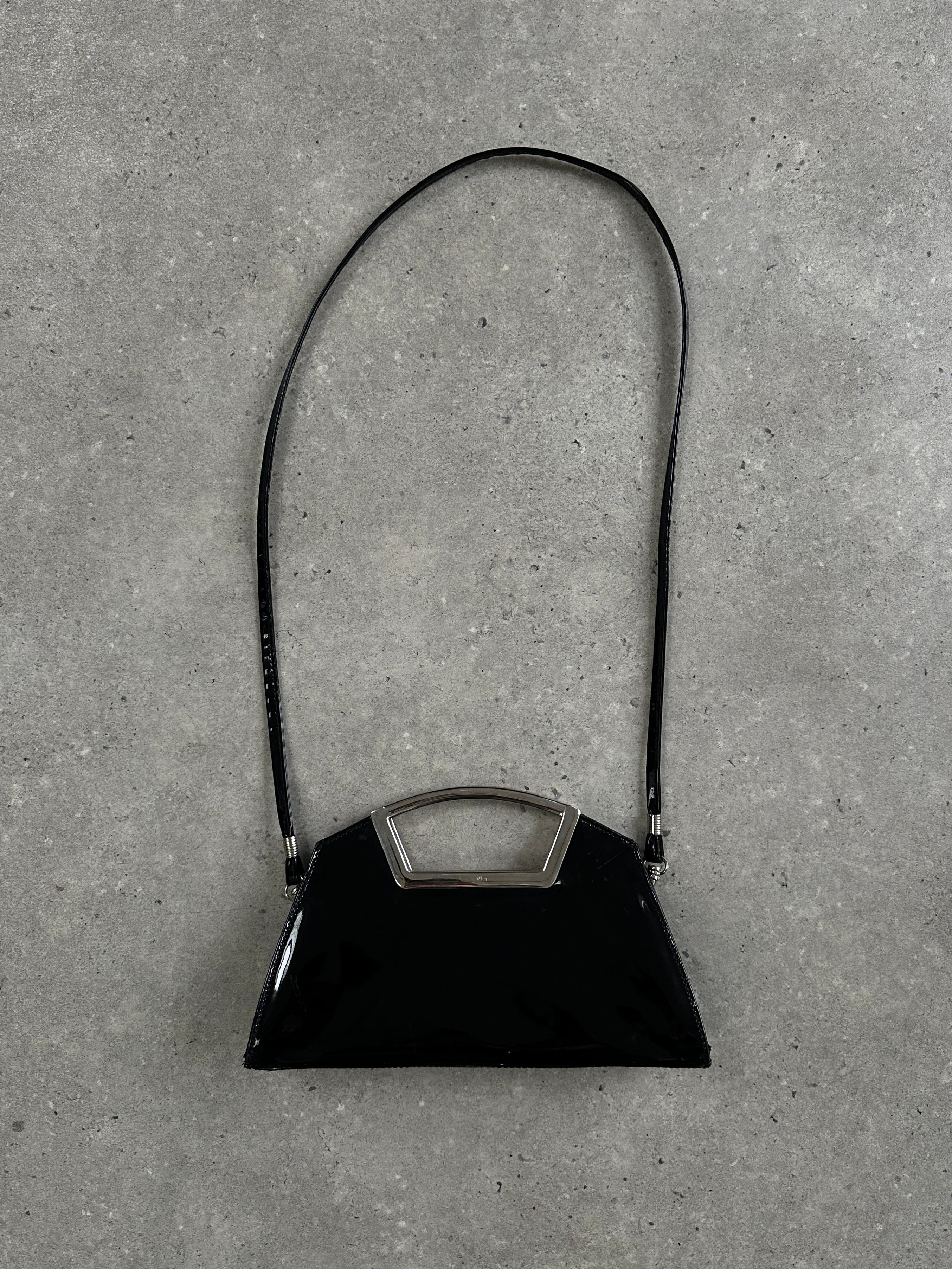 Vintage 2000s patent vinyl chrome crossbody clutch bag with sleek design and shiny finish, featuring a compact and stylish look.