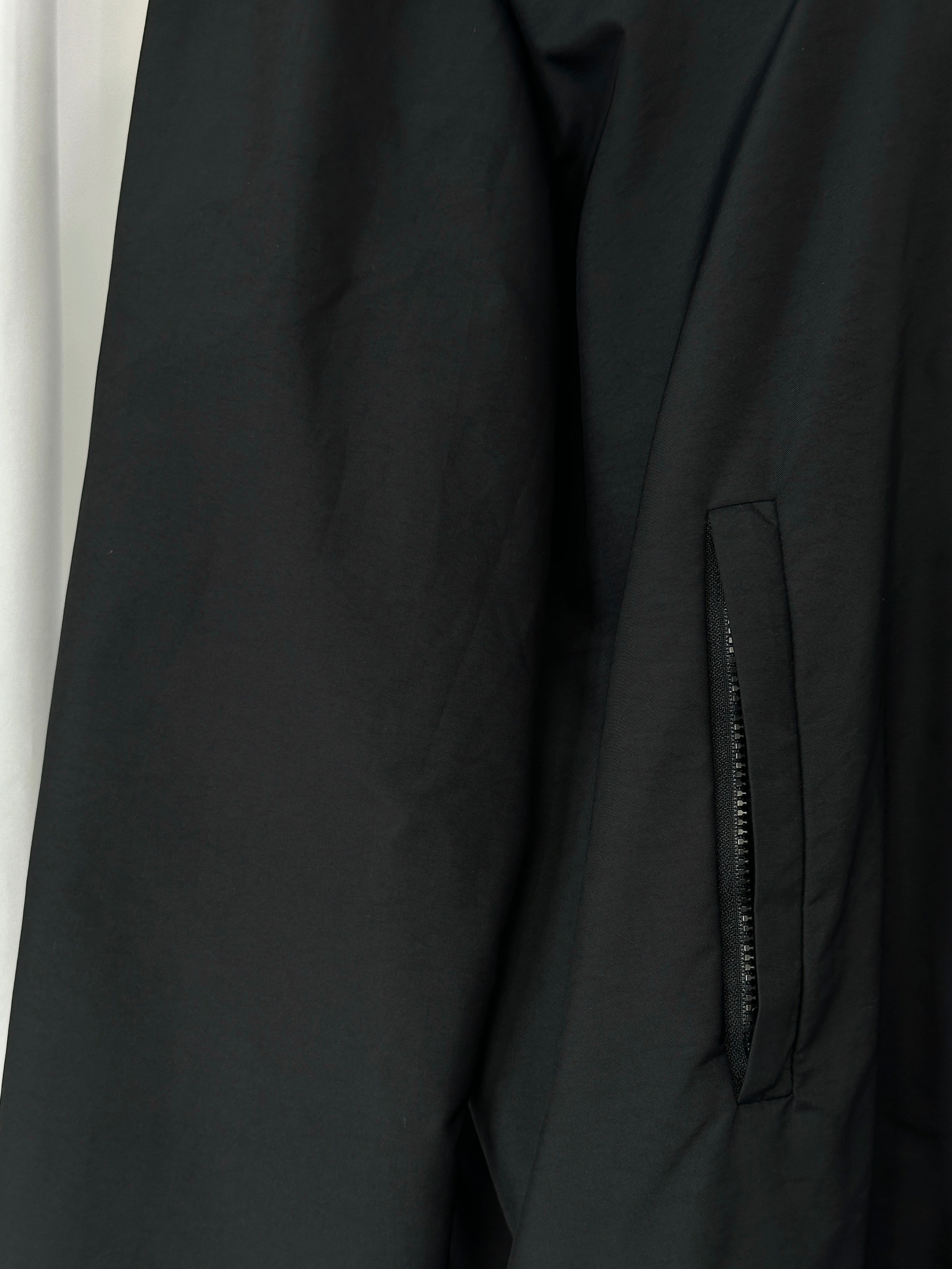Max Mara Weekend 2000s black bomber jacket with concealed placket, short style, and ribbed cuffs, size M.