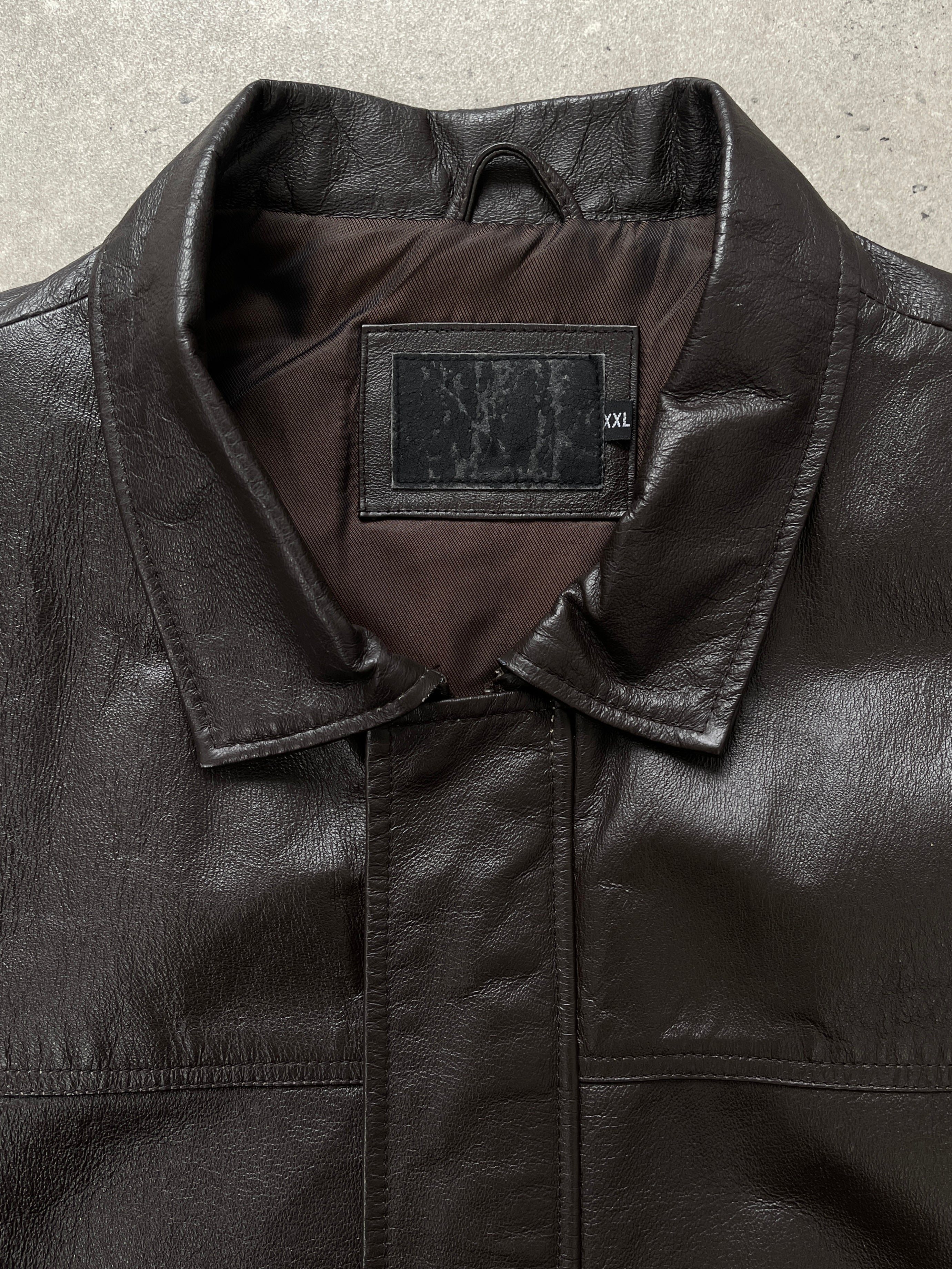 Vintage 1990s leather bomber jacket with concealed placket, in XL/XXL size, featuring classic design and textured leather material.