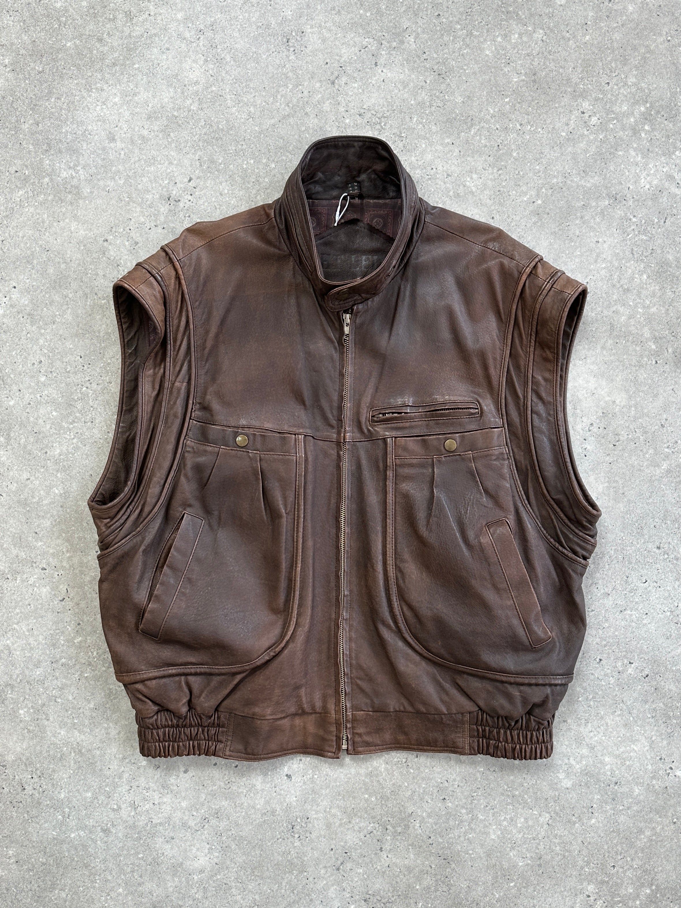 Vintage high neck aged leather bomber jacket in size L/XL, featuring a rugged, stylish design with detailed stitching.