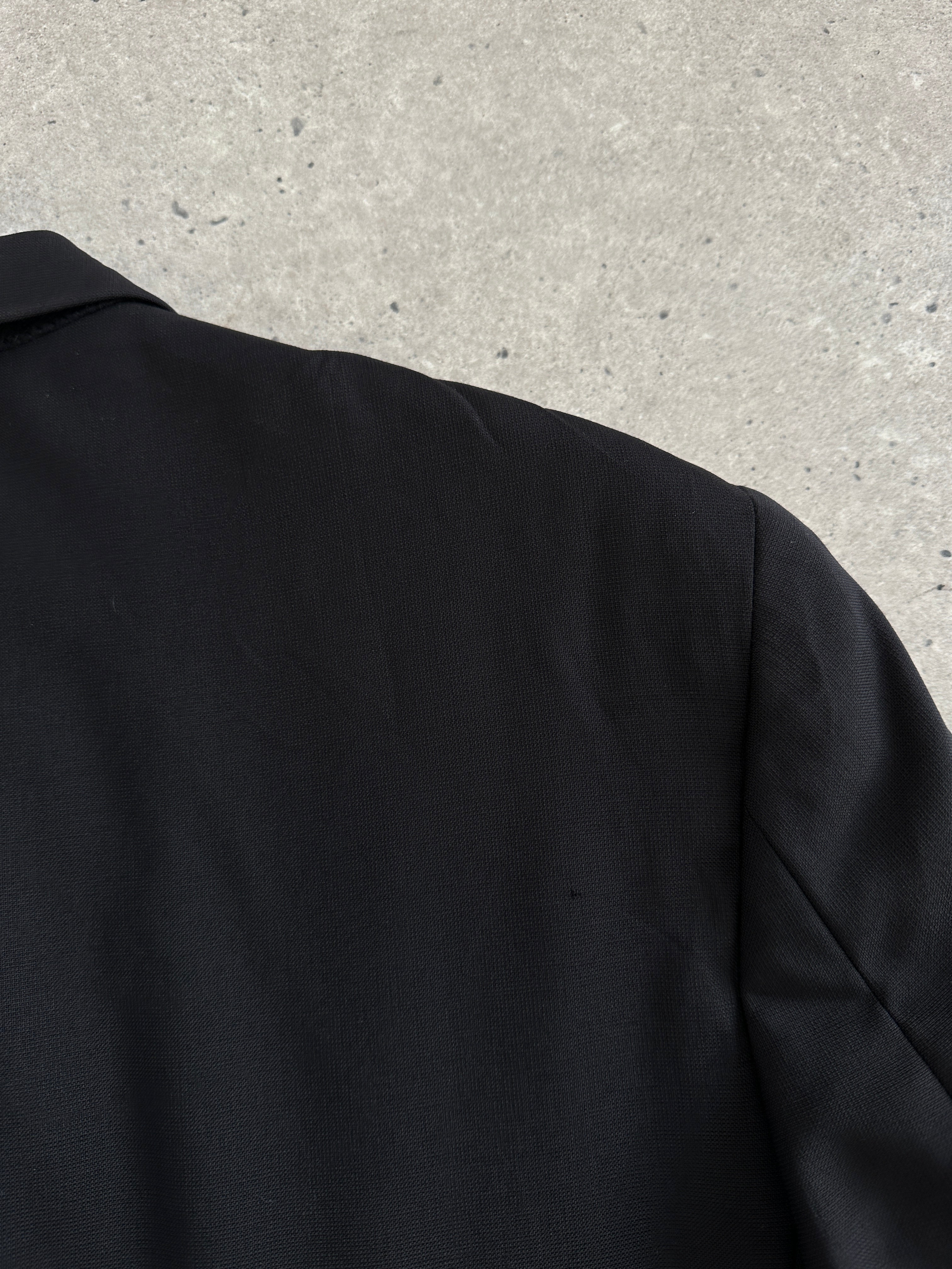Yves Saint Laurent Pour Homme 1990s pure wool single-breasted blazer in size 42R/XL, dark tailored design with notch lapels.
