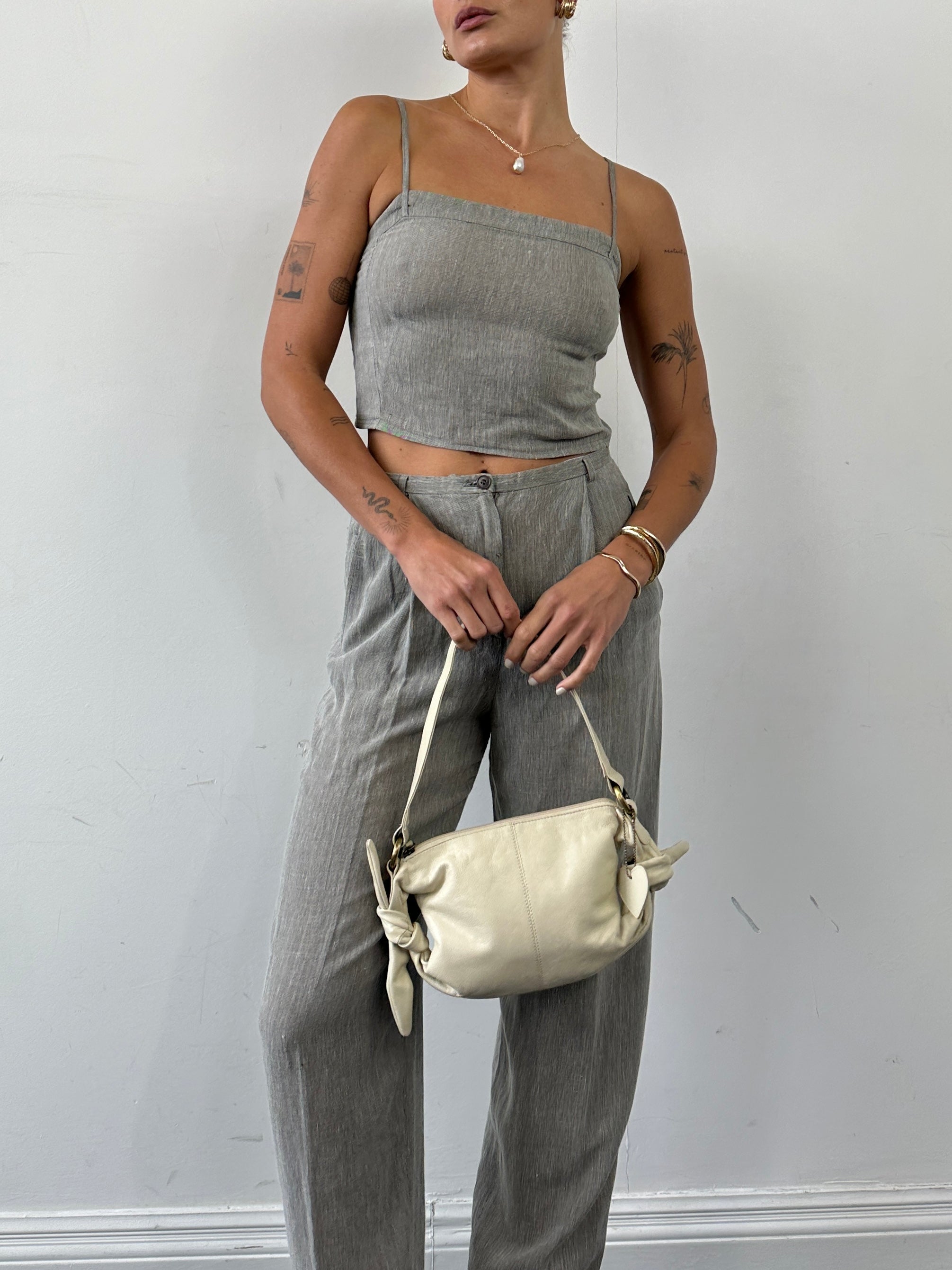 Mani linen two-piece top and trouser co-ord set, featuring stylish linen trousers and a matching top, in a sophisticated design.