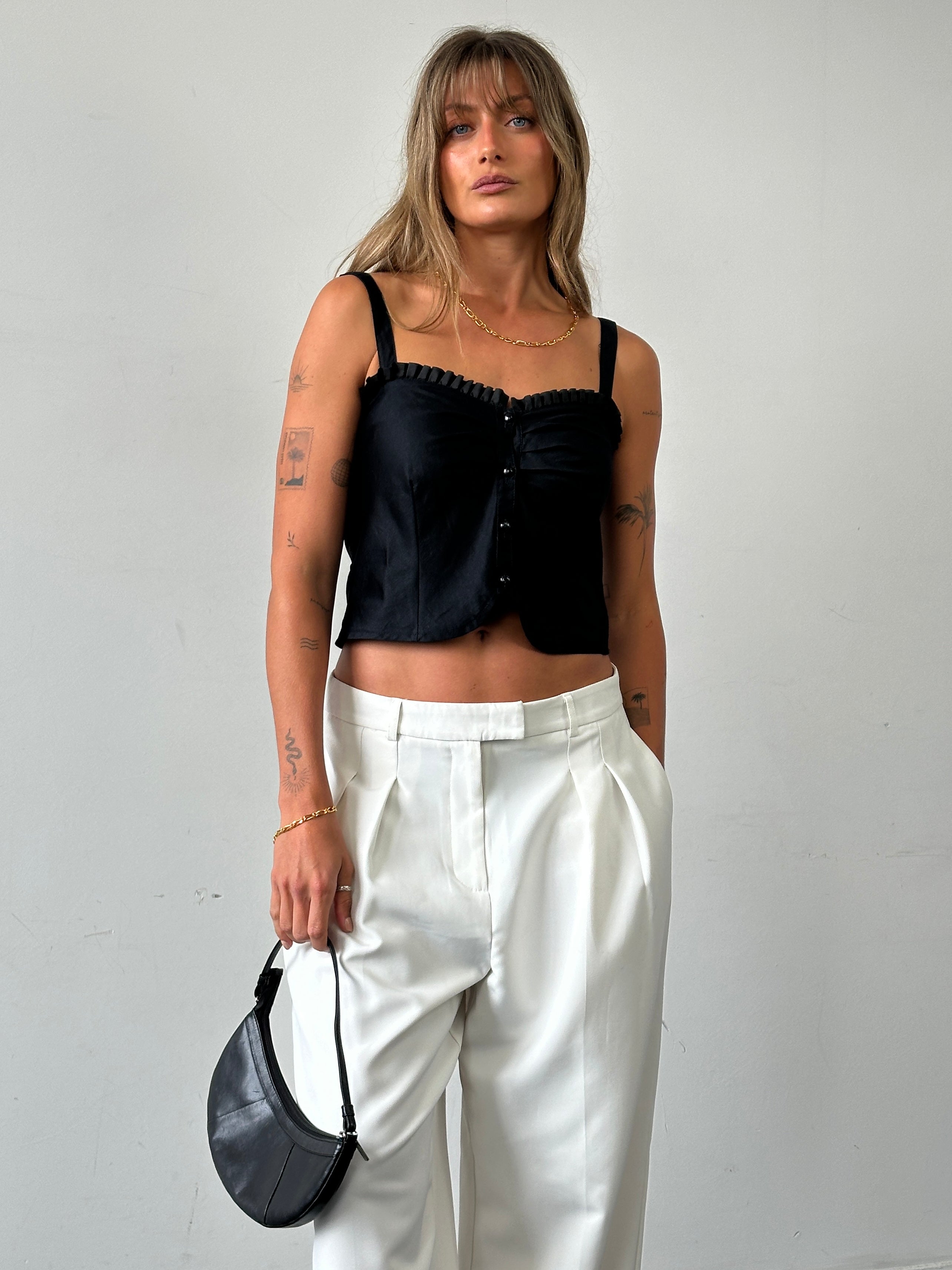 Vintage brand vintage frill trim crop top, size small, with ruffled detailing and lightweight fabric, displayed on a mannequin.