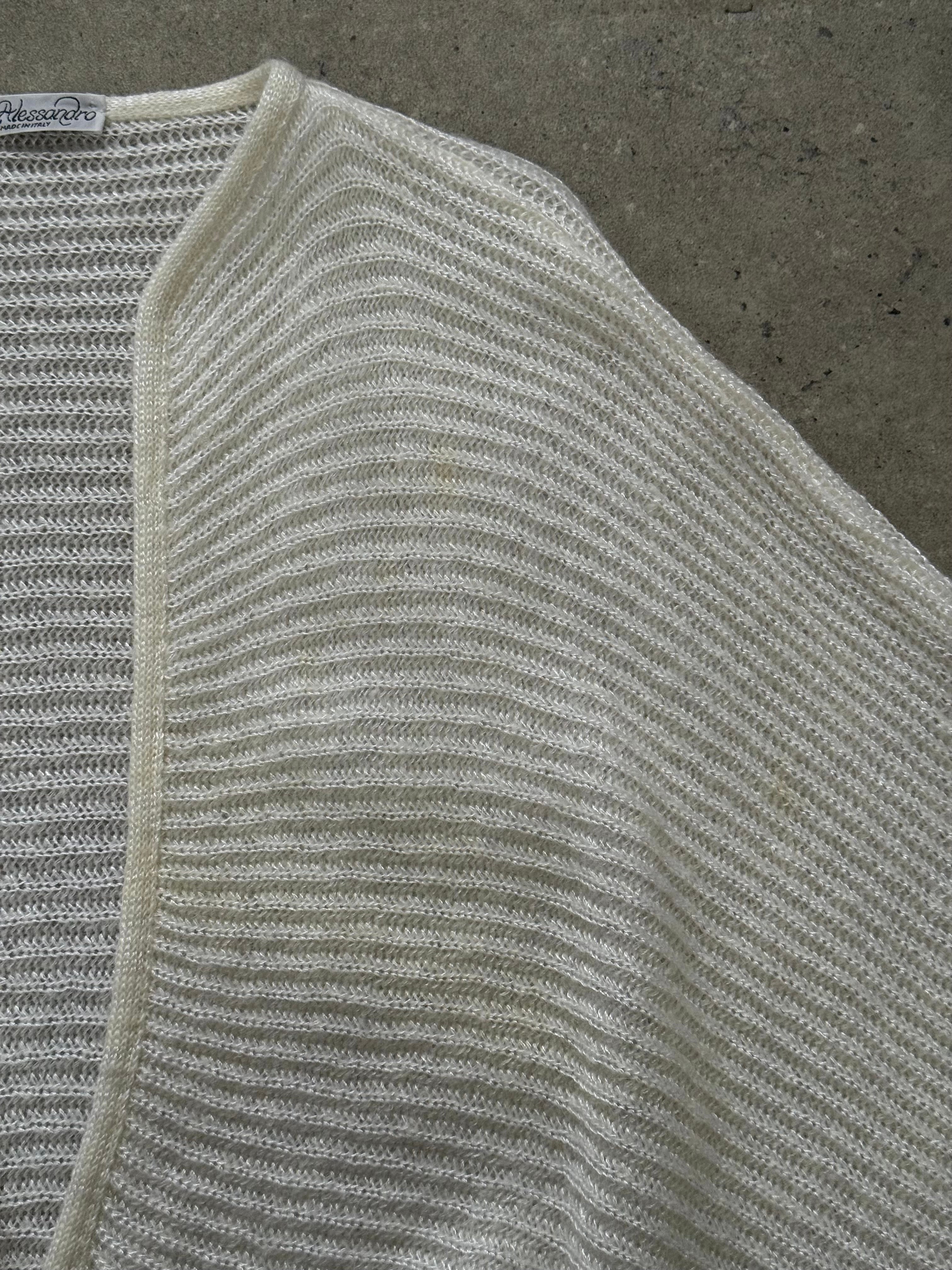 Vintage Italian 1990s mohair knitted cardigan in size M, showcasing soft, textured fabric and classic knit pattern.