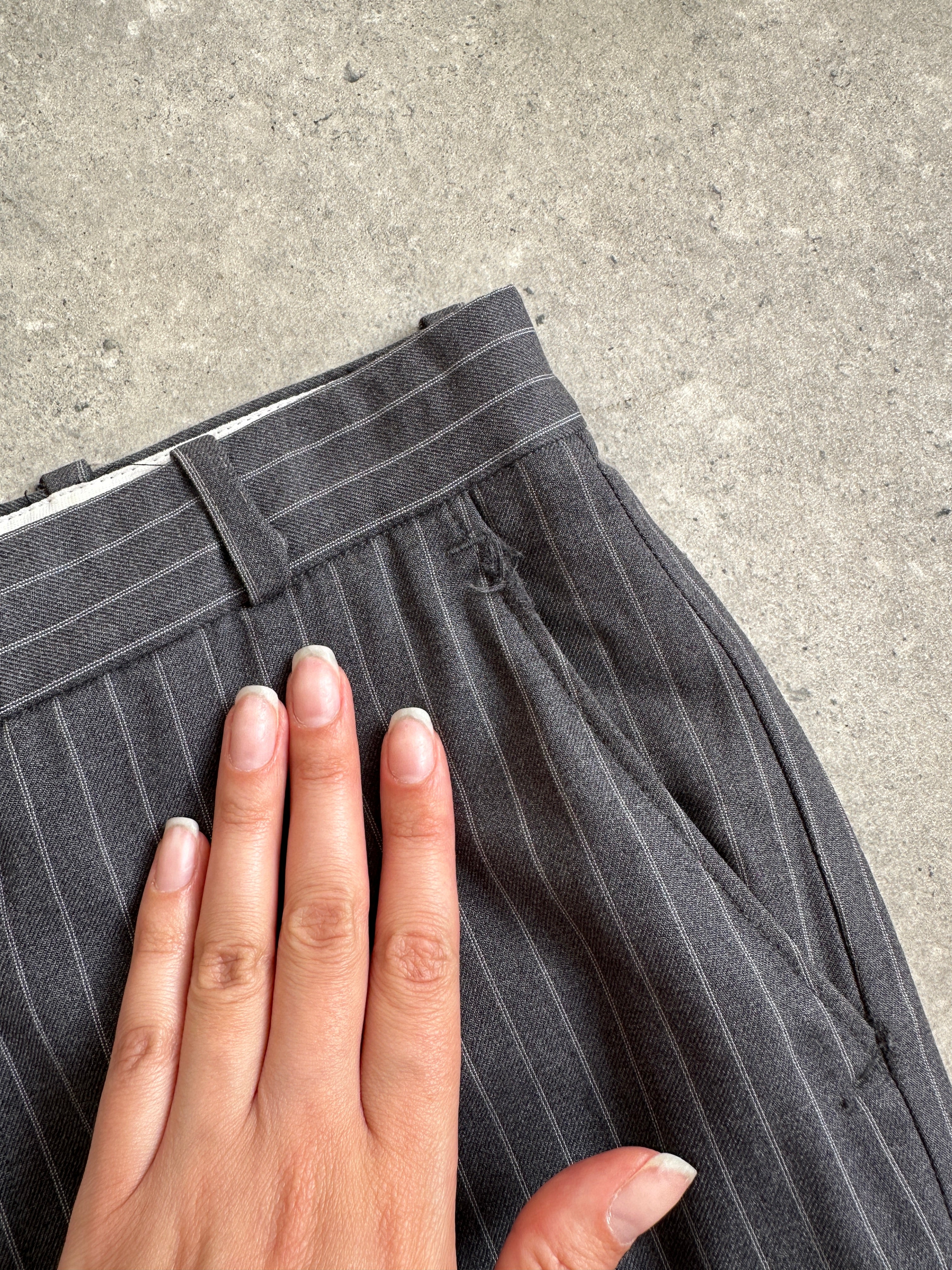 Christian Dior pinstripe wool mid-waist straight-leg trousers, size W30, shown on a hanger with a tailored fit and classic style.