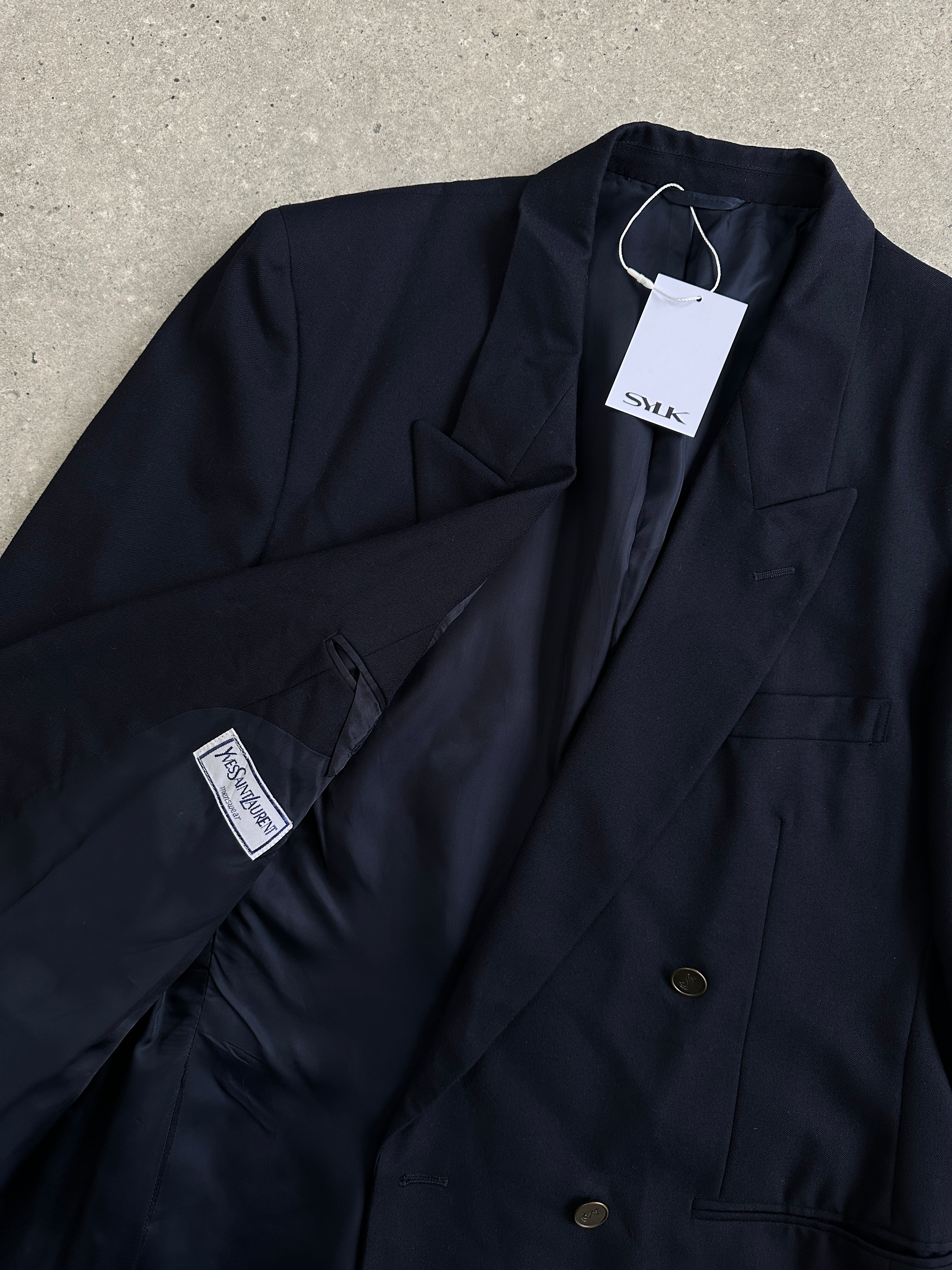 Yves Saint Laurent double-breasted pure wool blazer in size 42R/L-XL, shown in black with notch lapels and tailored fit.