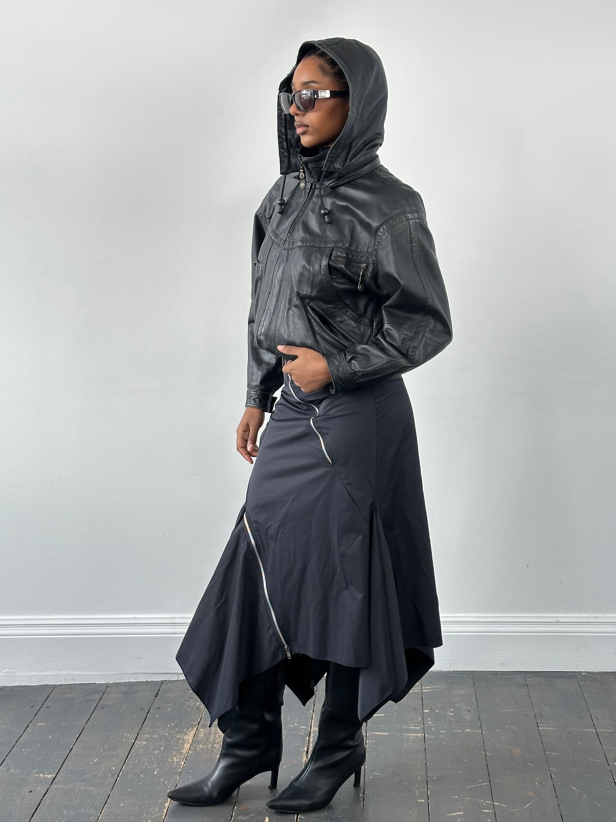 Vintage 1990s leather funnel neck hooded bomber jacket, size small, with zip closure and classic retro style.