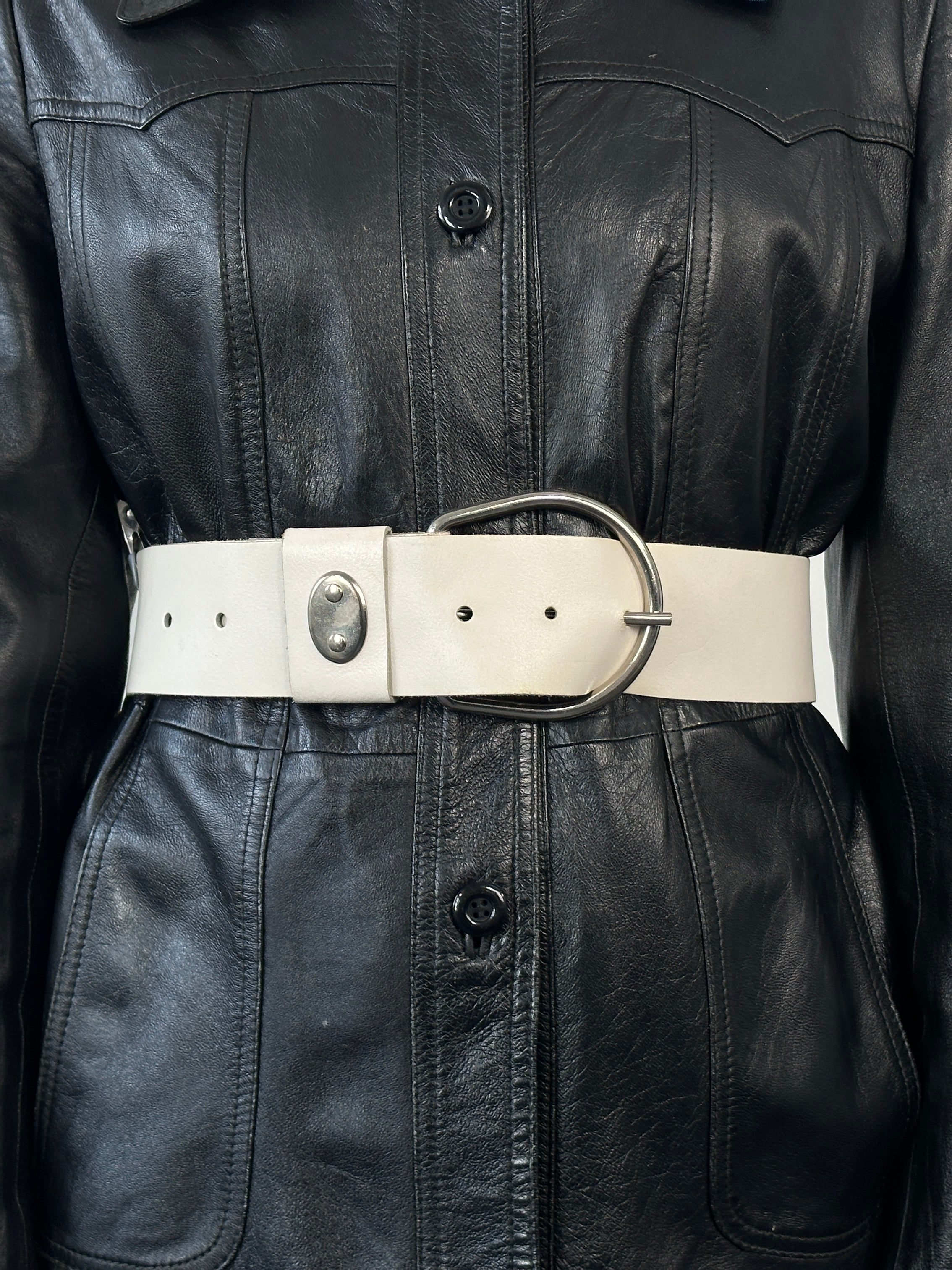 Vintage 1990s chrome chunky leather belt with metal buckle, size W27-34, styled for a retro fashion look.