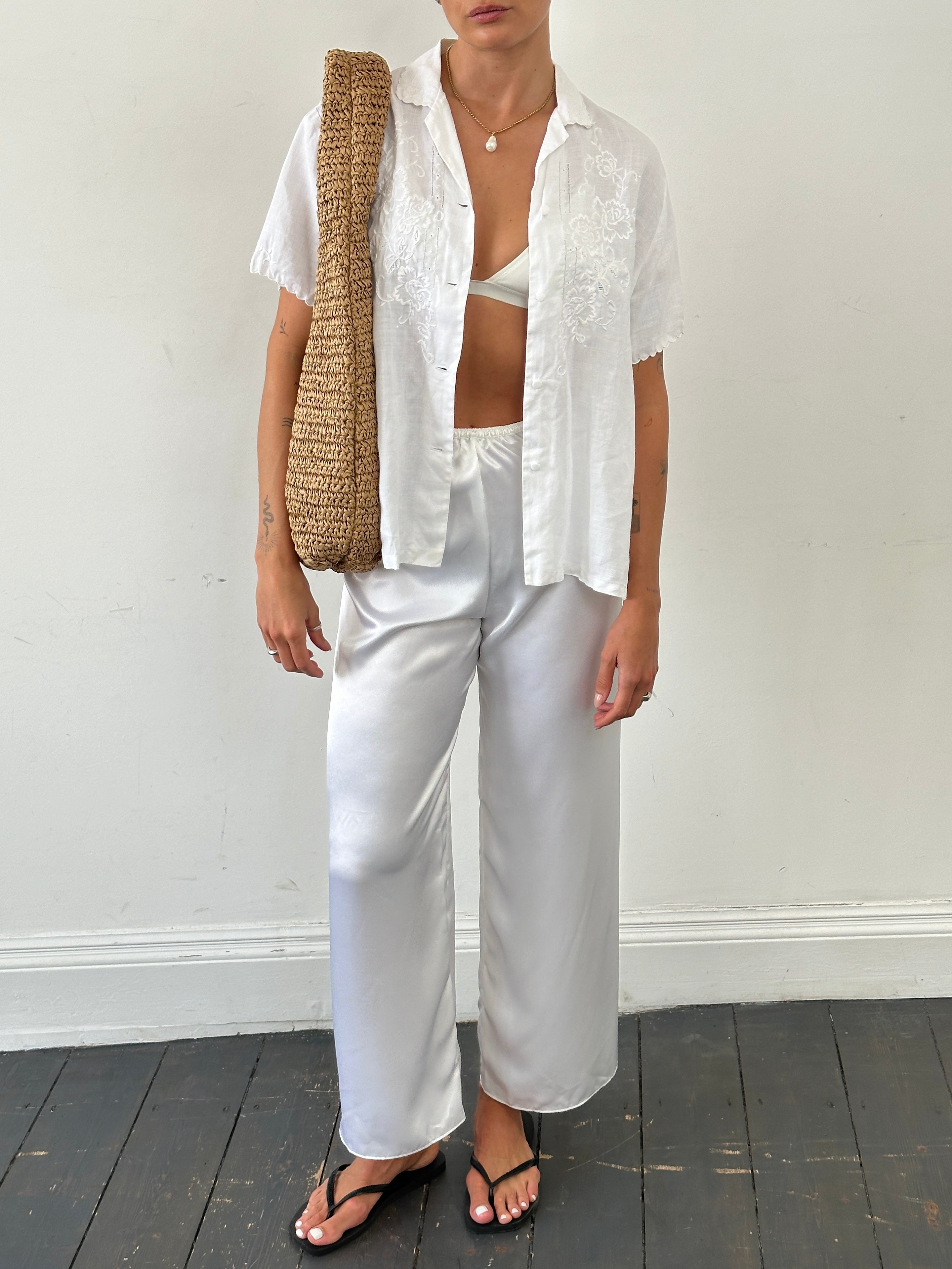 Vintage satin elasticated straight leg trousers in W25-28, shown in a stylish, smooth fabric with a relaxed fit.