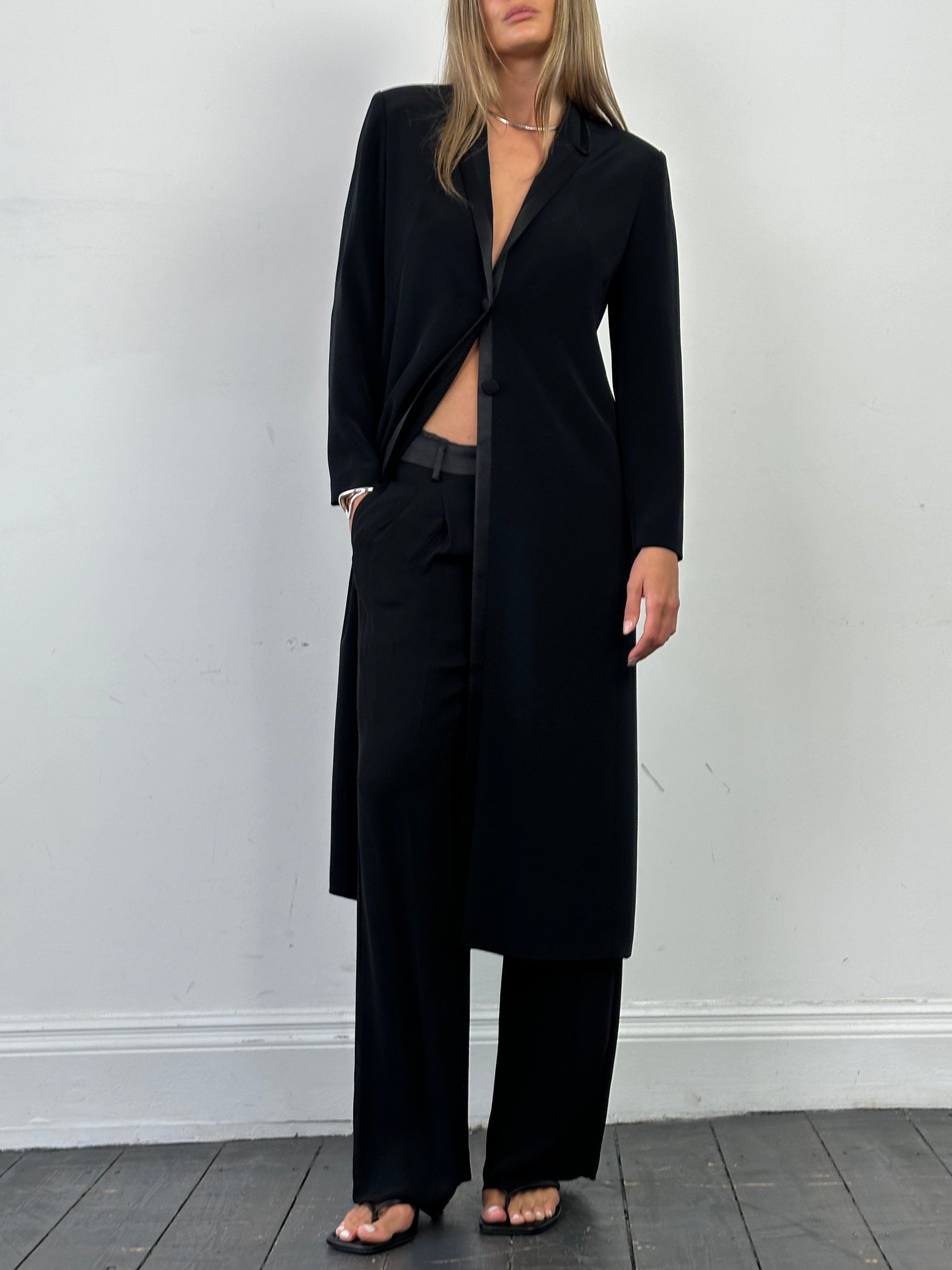 Vintage lightweight tuxedo coat in size small, stylish men's formal coat with classic design and sleek black fabric.