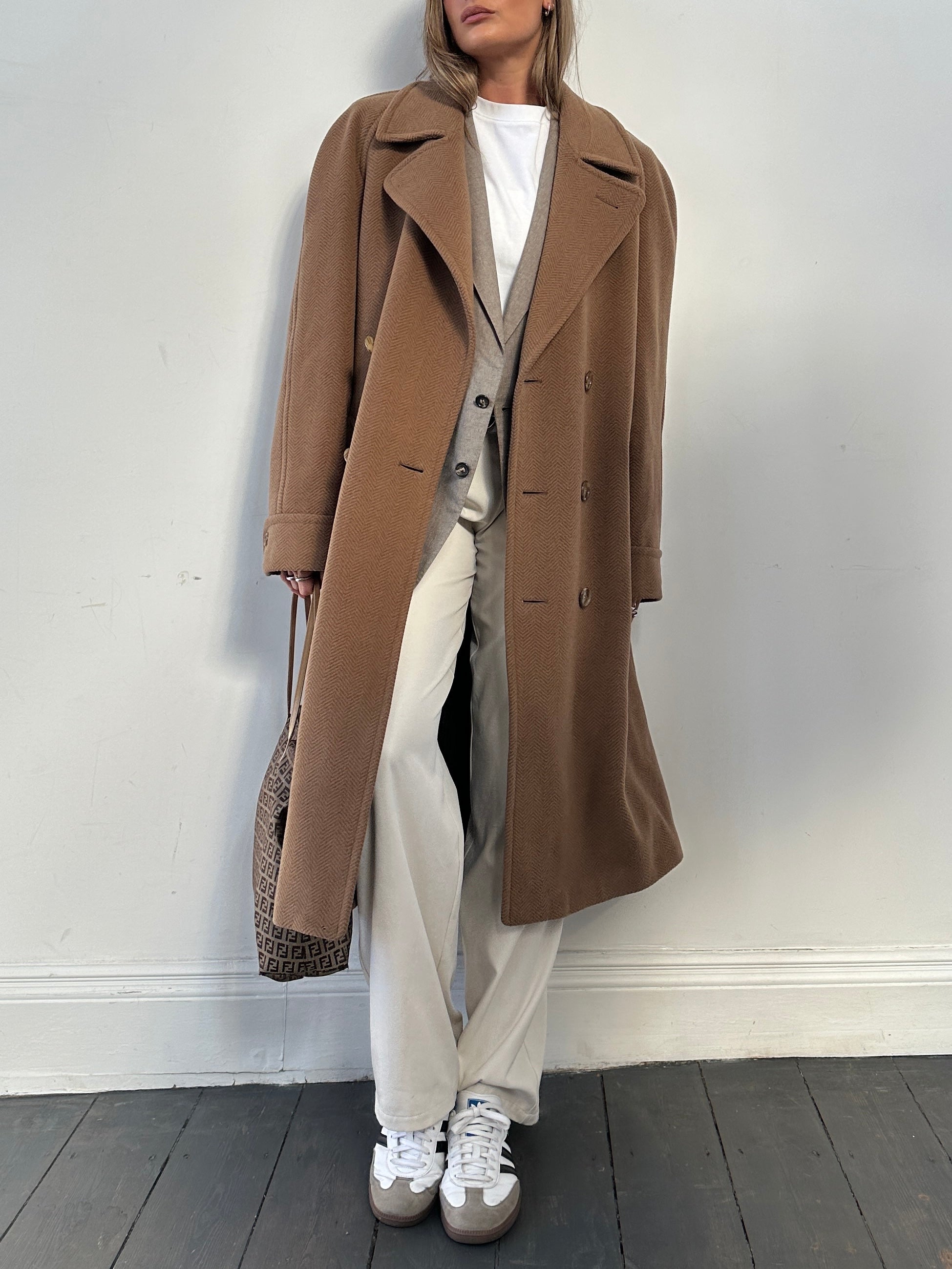 Christian Dior wool coat with belted double-breasted design, shown in classic style, front view with lapels and button details.