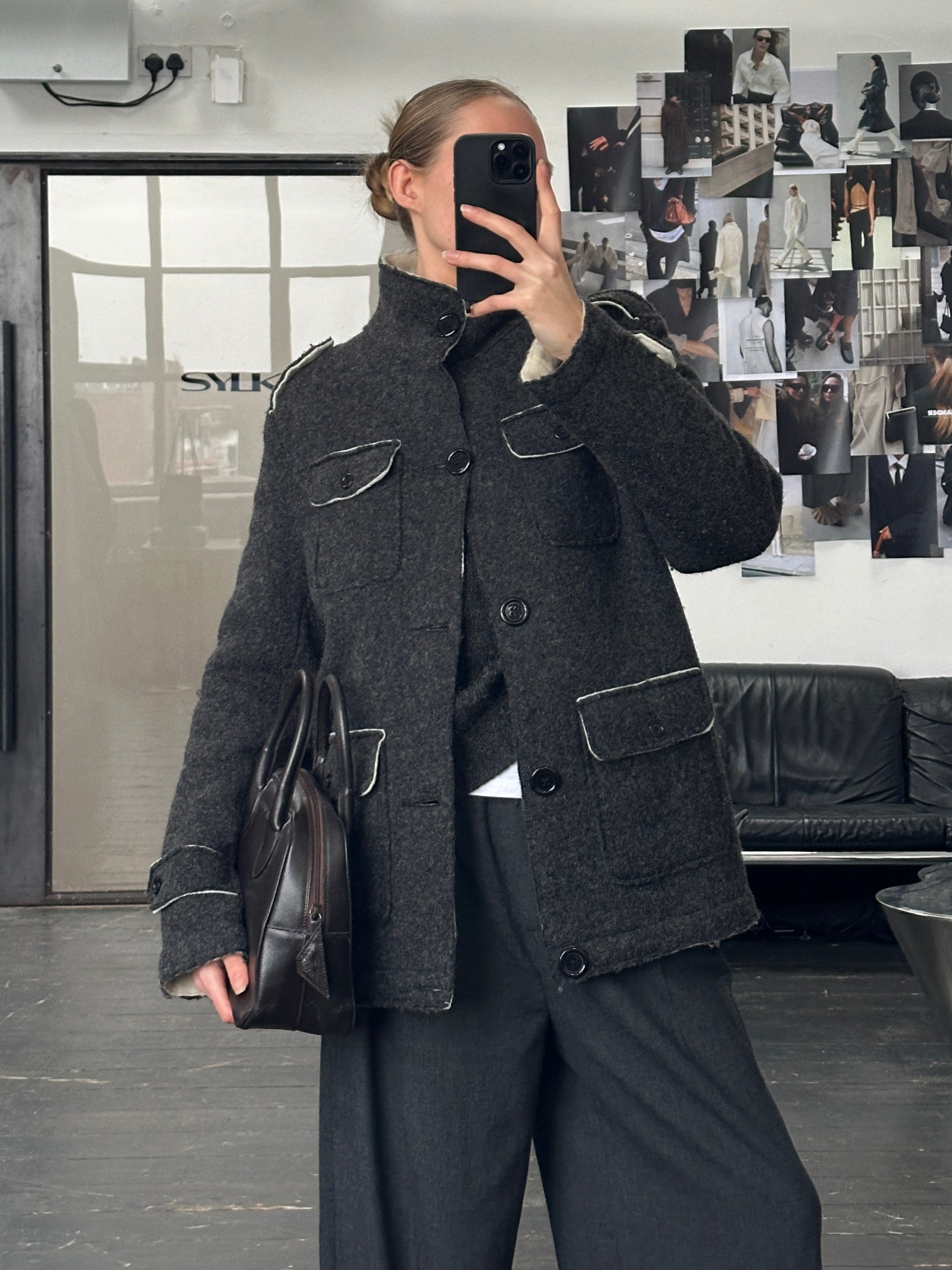 Vintage 1990s wool high neck utility jacket in size large, featuring a classic design with a button-up front and practical pockets.