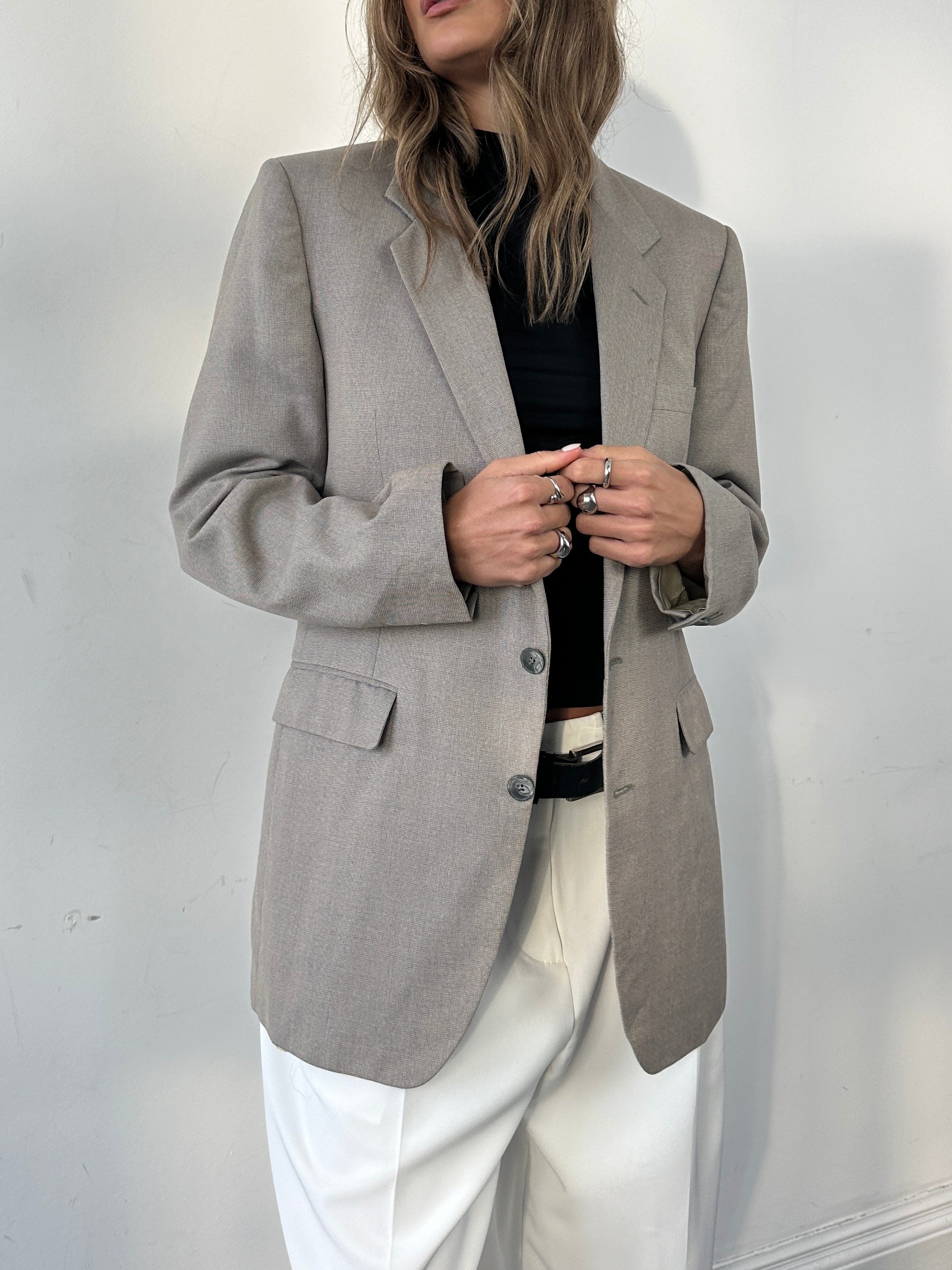 Givenchy wool single-breasted blazer for men, tailored fit, classic design, in a neutral color, shown on a hanger.