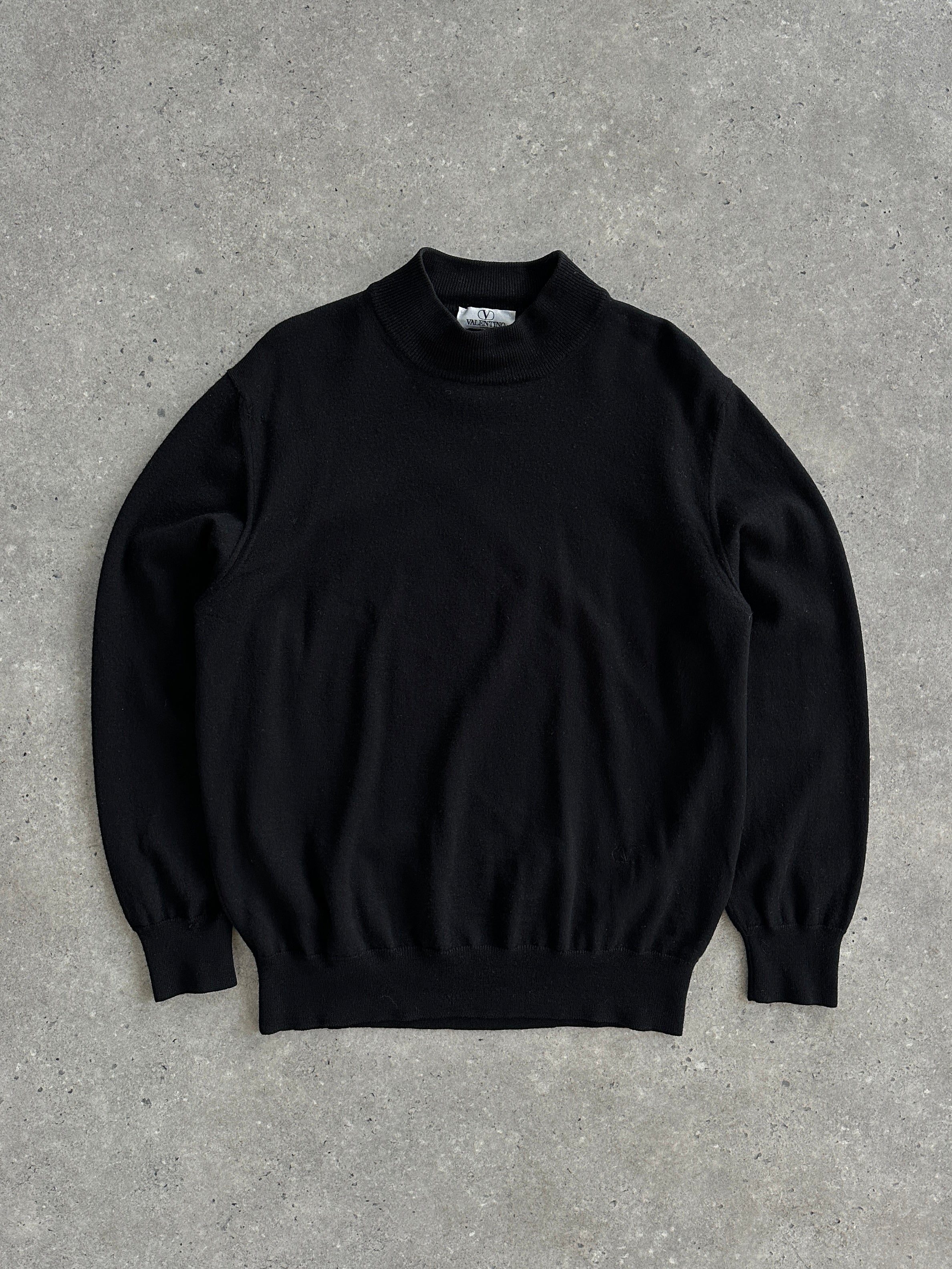 Valentino pure wool logo turtleneck jumper in M/L, featuring a classic design and ribbed collar, shown on a neutral background.