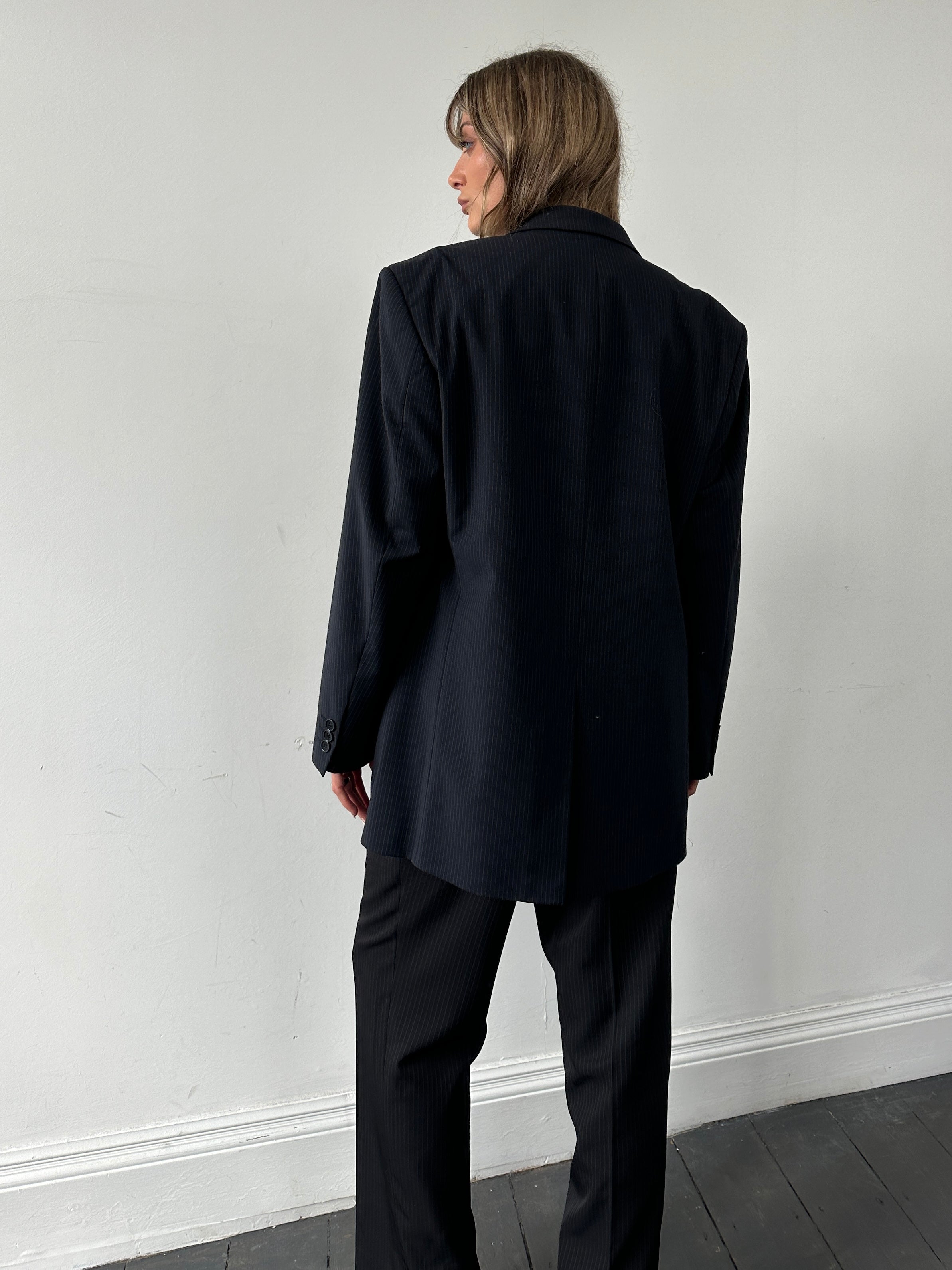 Balmain pinstripe wool blazer in size 42R/XL, single-breasted design with notch lapels and tailored fit.