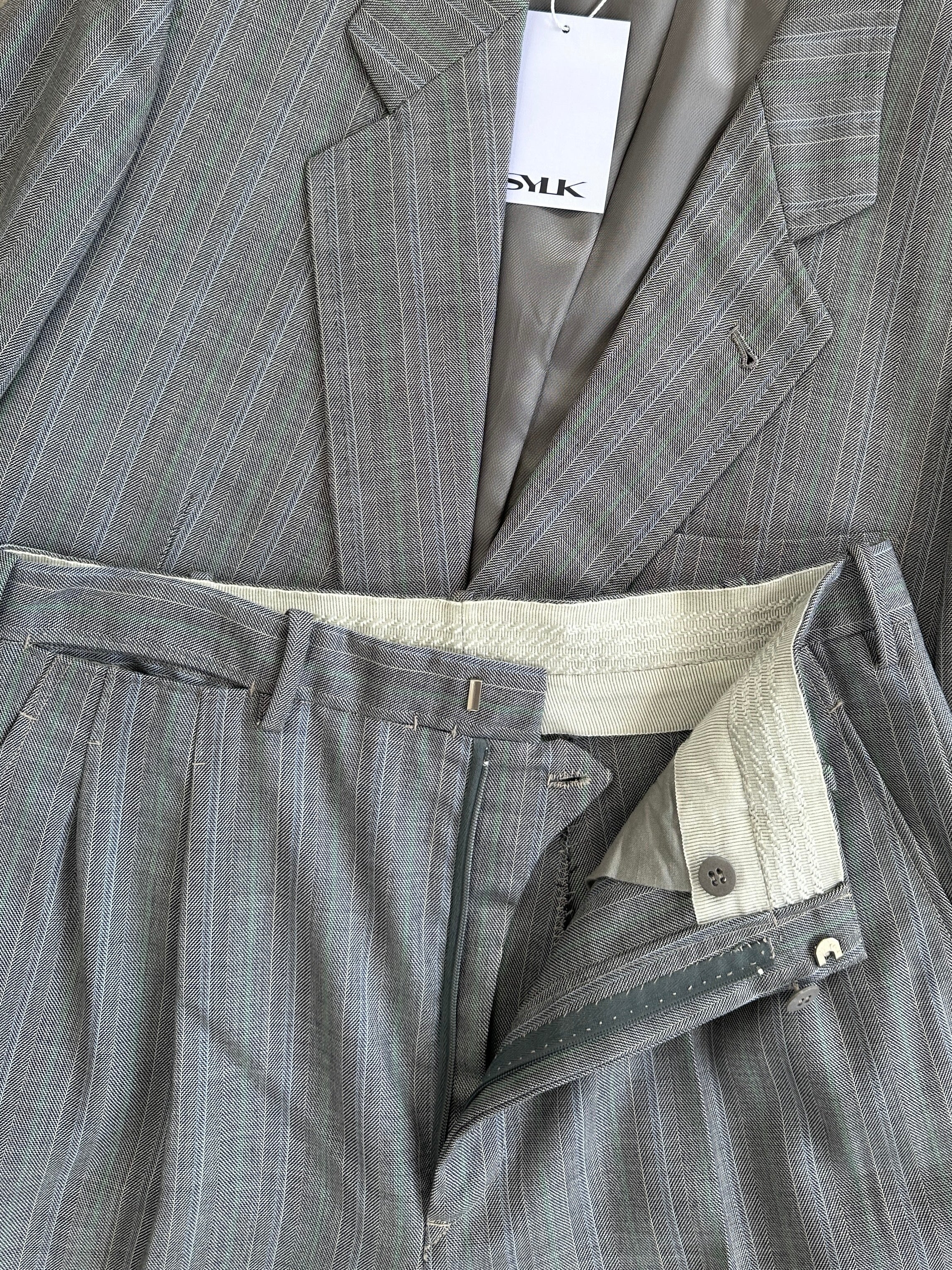 Vintage Italian vintage pure wool stripe double-breasted suit, size 36R/W28, featuring classic tailored design and bold stripe pattern.