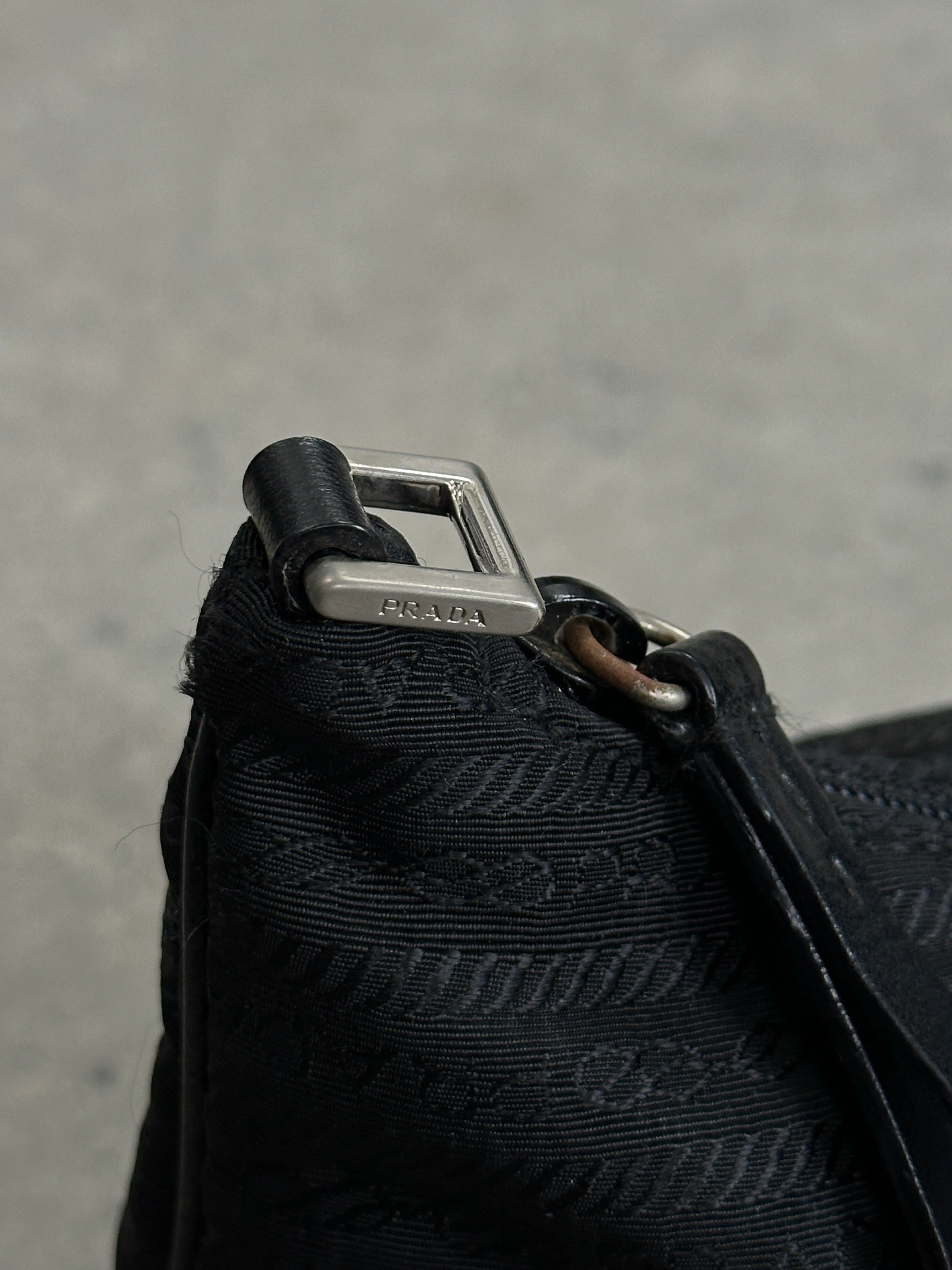 Prada Nylon Tessuto Monogram Crossbody Bag with adjustable strap and signature logo pattern, featuring a sleek, durable design.