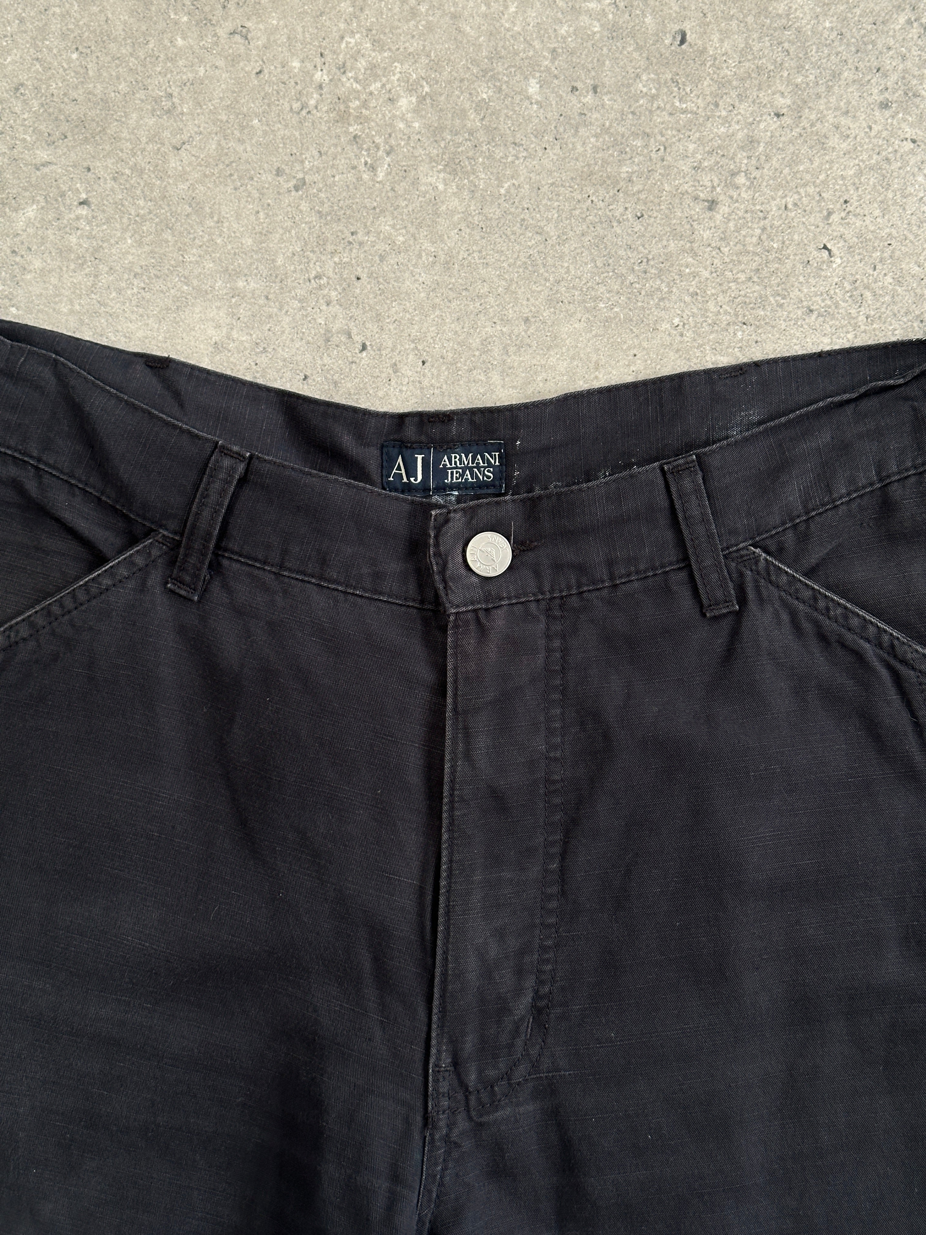 Armani Jeans cotton wide-leg trousers in size W32, featuring a relaxed fit and classic design, shown on a neutral background.