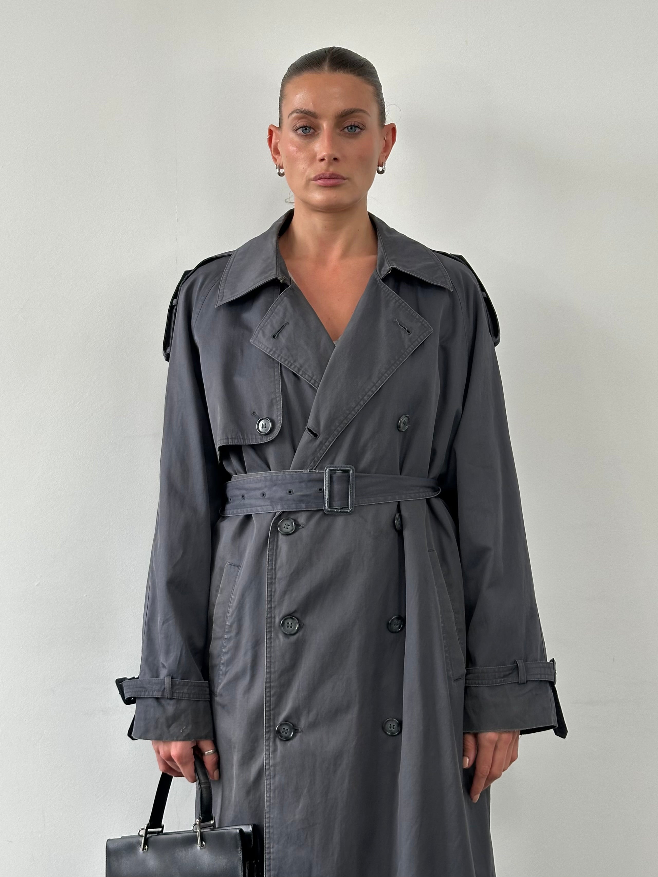 Yves Saint Laurent cotton double-breasted belted trench coat in XL, showcasing classic design with wide lapels and a waist belt.