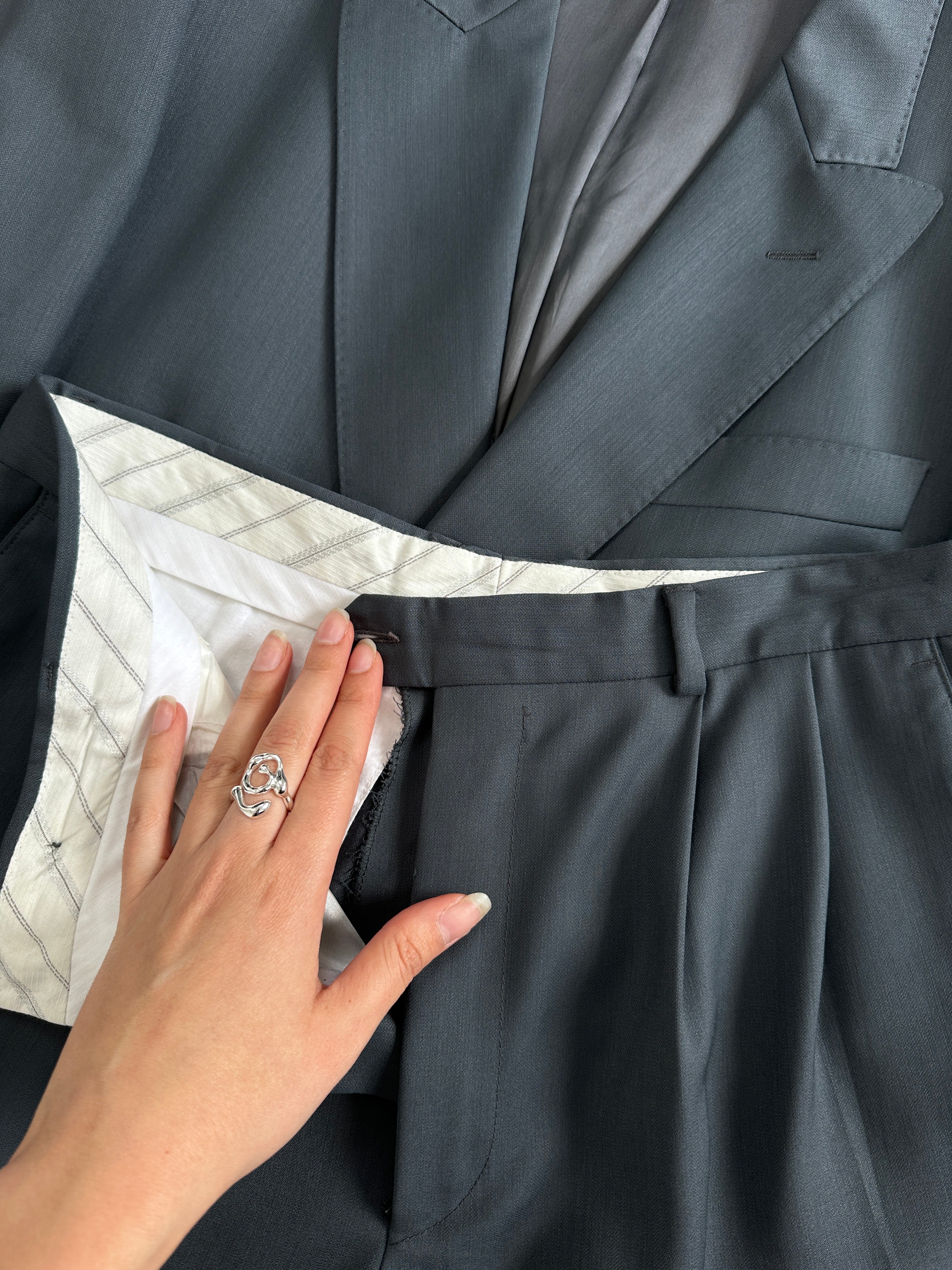 Vintage Italian pure wool double-breasted blazer in size 40R/W28, classic tailored fit, with notch lapels and button details.