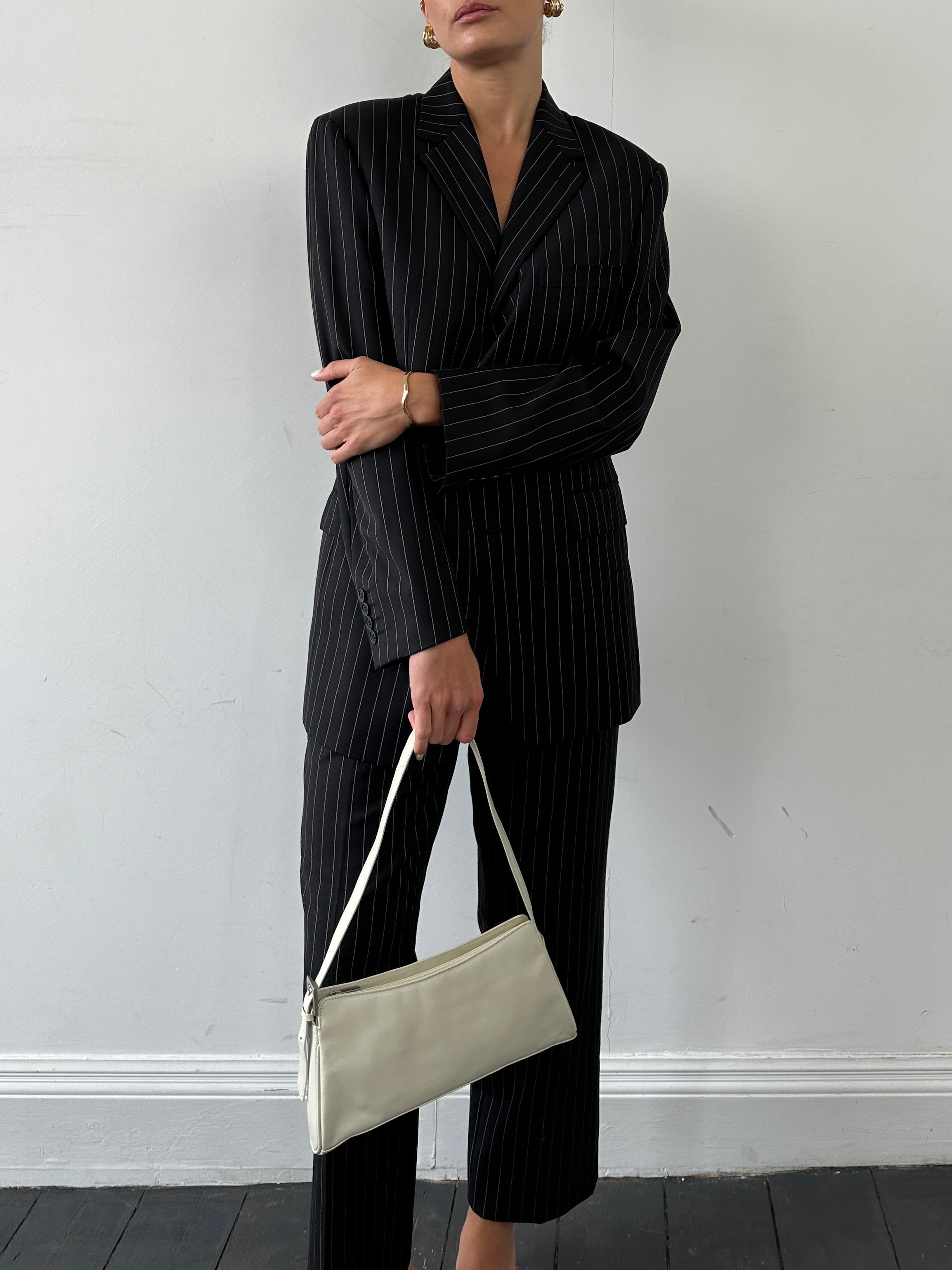 Yves Saint Laurent Pour Homme pinstripe pure wool single-breasted suit, size 38S/W28, displayed on a mannequin.