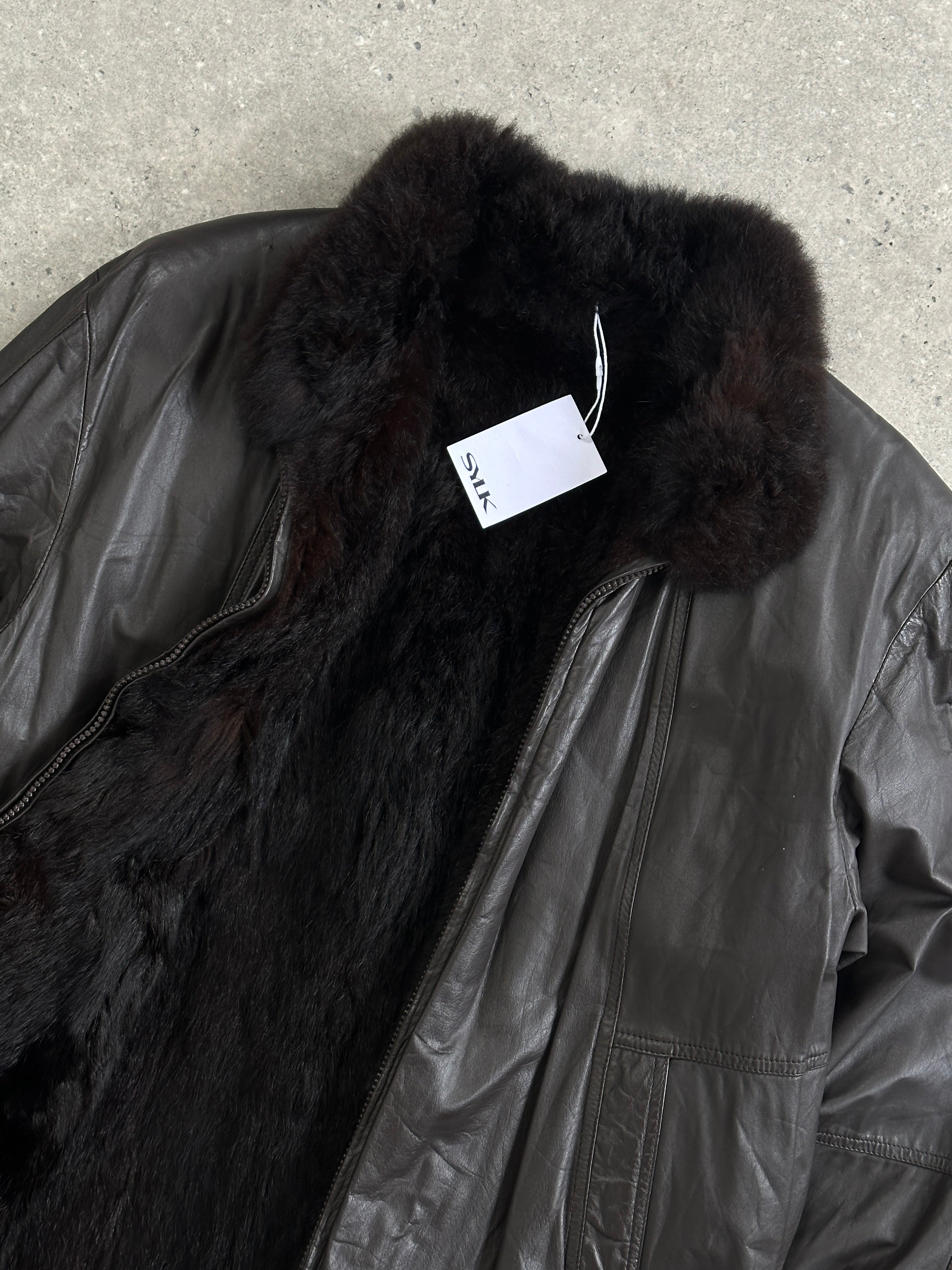 Vintage leather bomber jacket with vintage faux fur lining, slim fit, minimal design, in size small, stylish and warm.