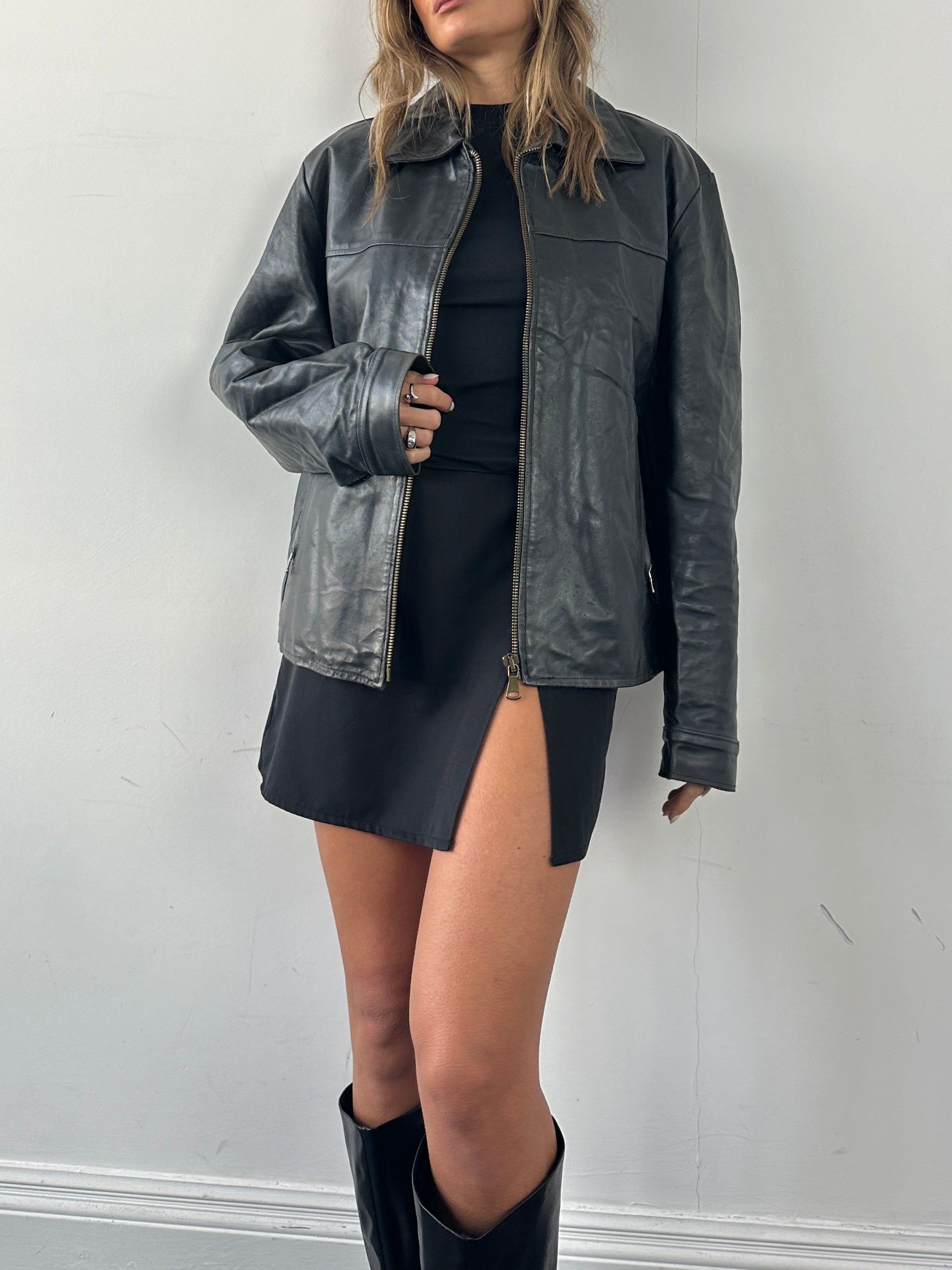 Vintage brand vintage leather jacket in size large, showcasing classic distressed brown leather with detailed stitching.
