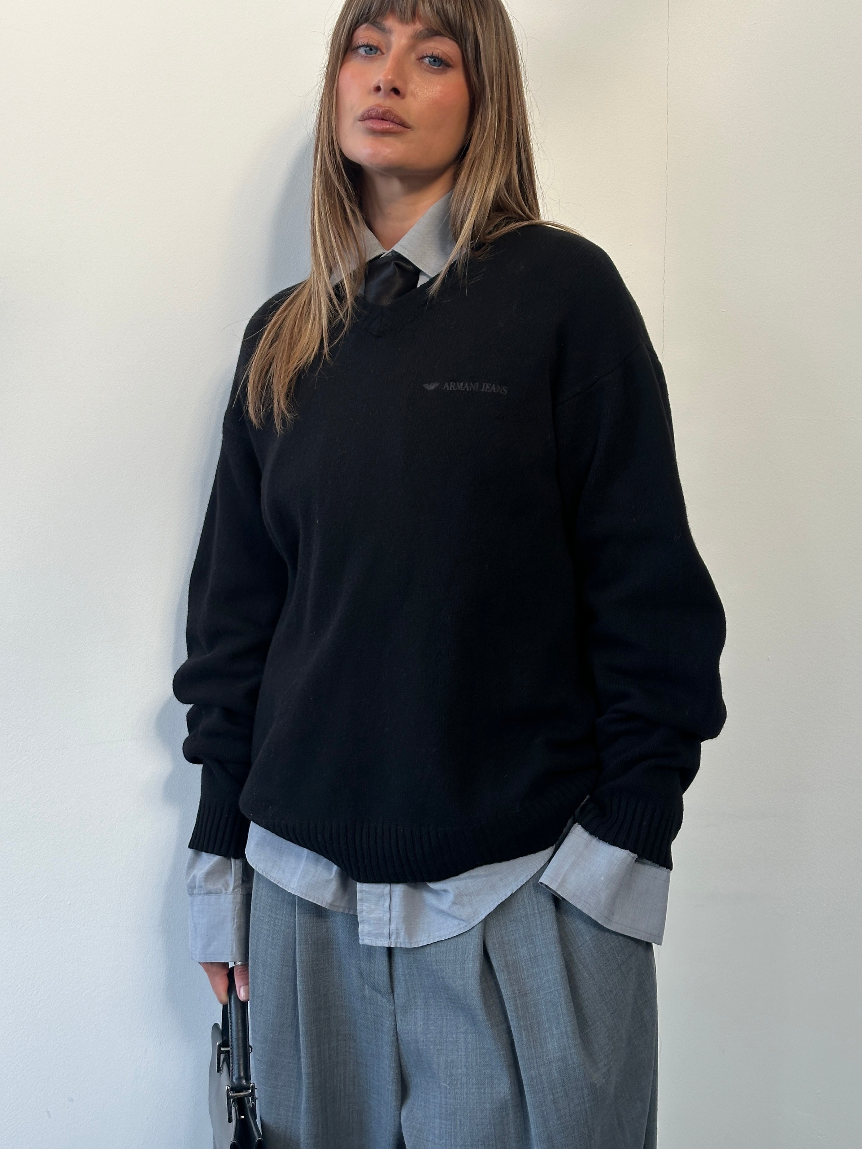 Armani Jeans 1990s wool V-neck knitted jumper with logo in size L/XL, showcasing a cozy, stylish design.