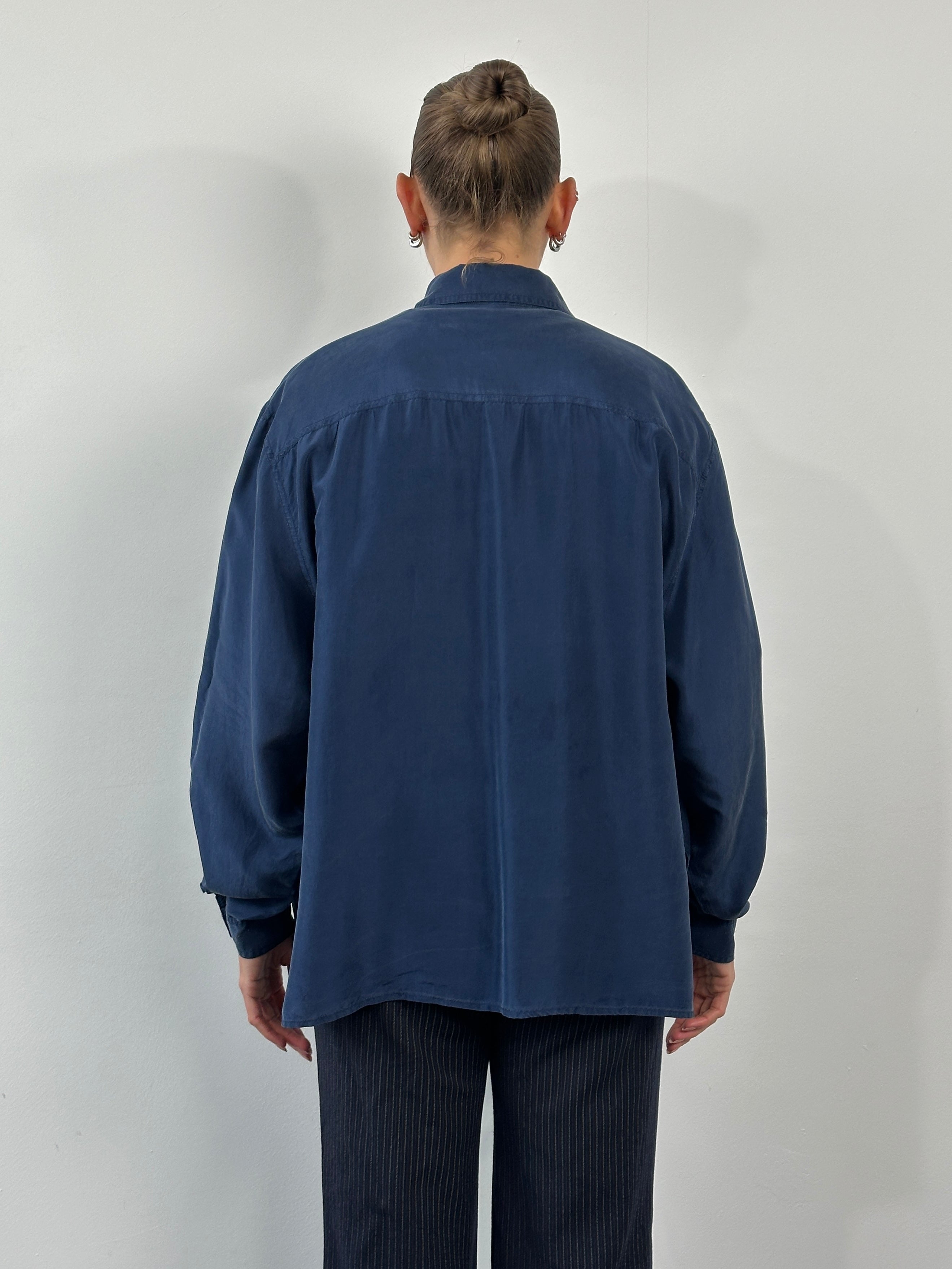 Vintage 1990s pure silk shirt in size large, featuring a classic design and smooth fabric.