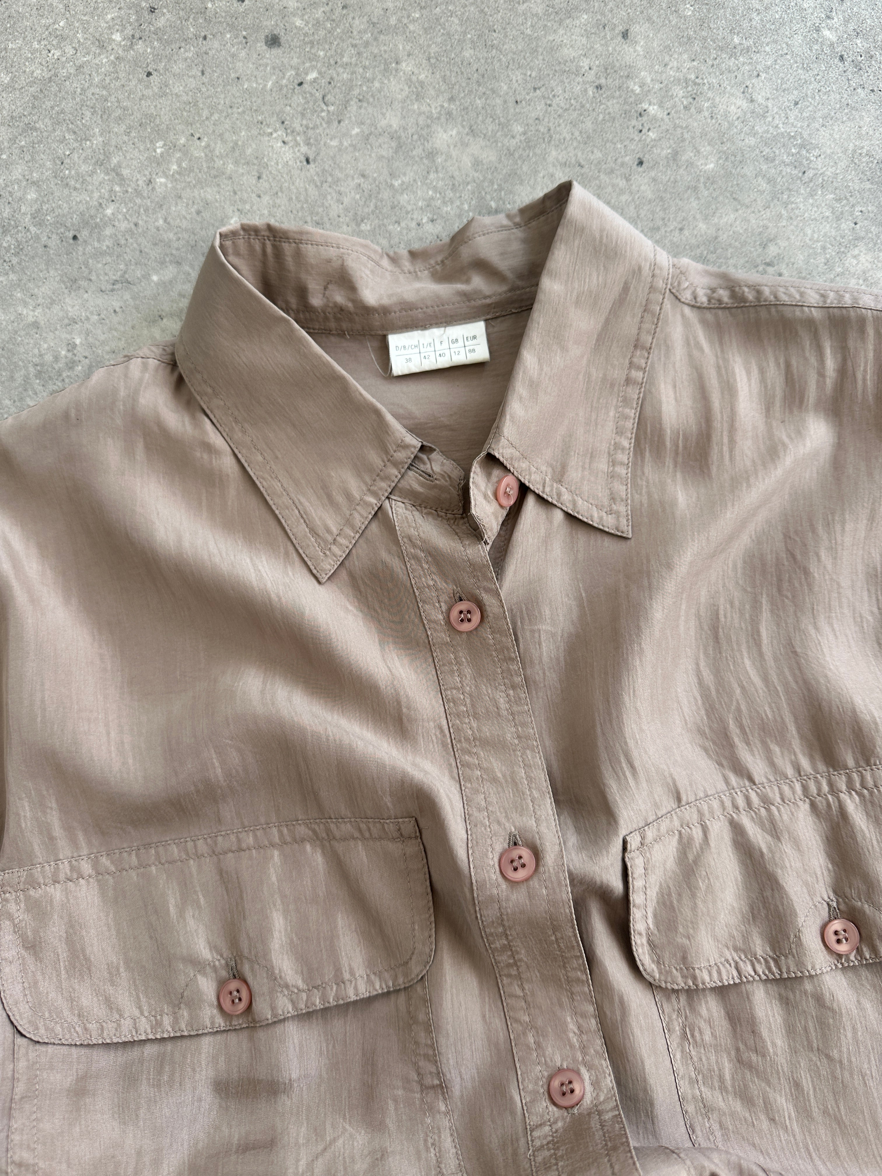 Vintage 1990s pure silk shirt in size M/L, featuring a classic design and smooth fabric, displayed on a neutral background.