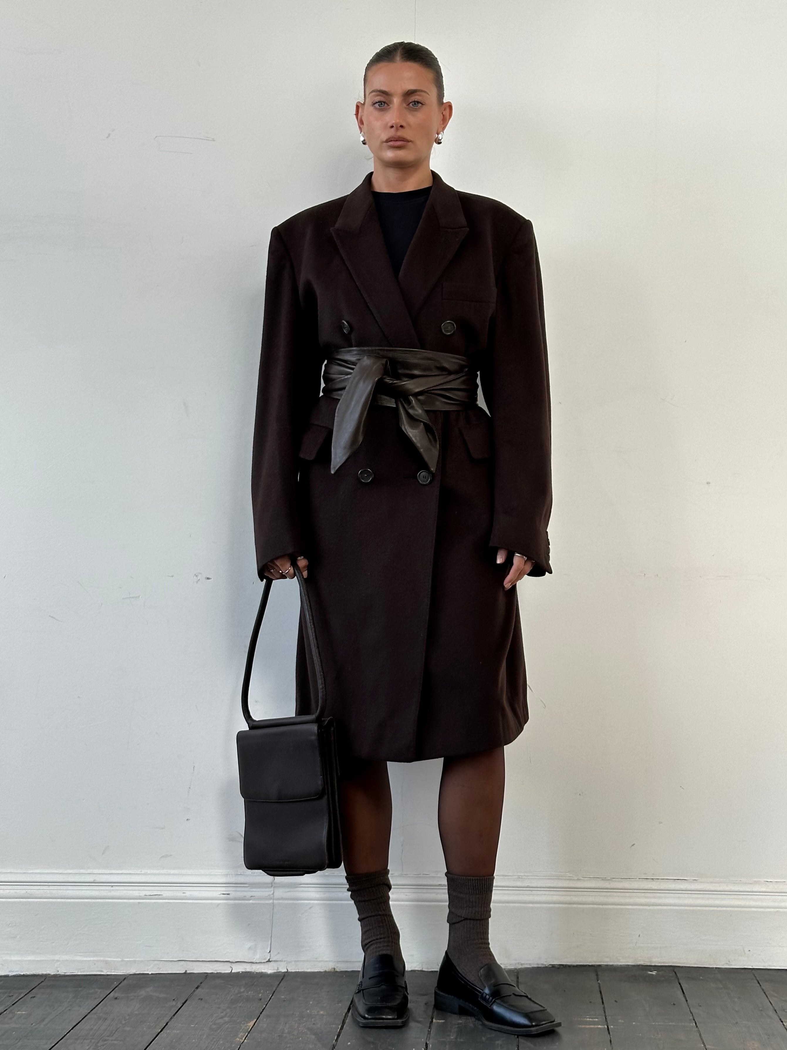 Christian Dior wool cashmere double-breasted coat in XL, showcasing a tailored design with classic lapels and button details.