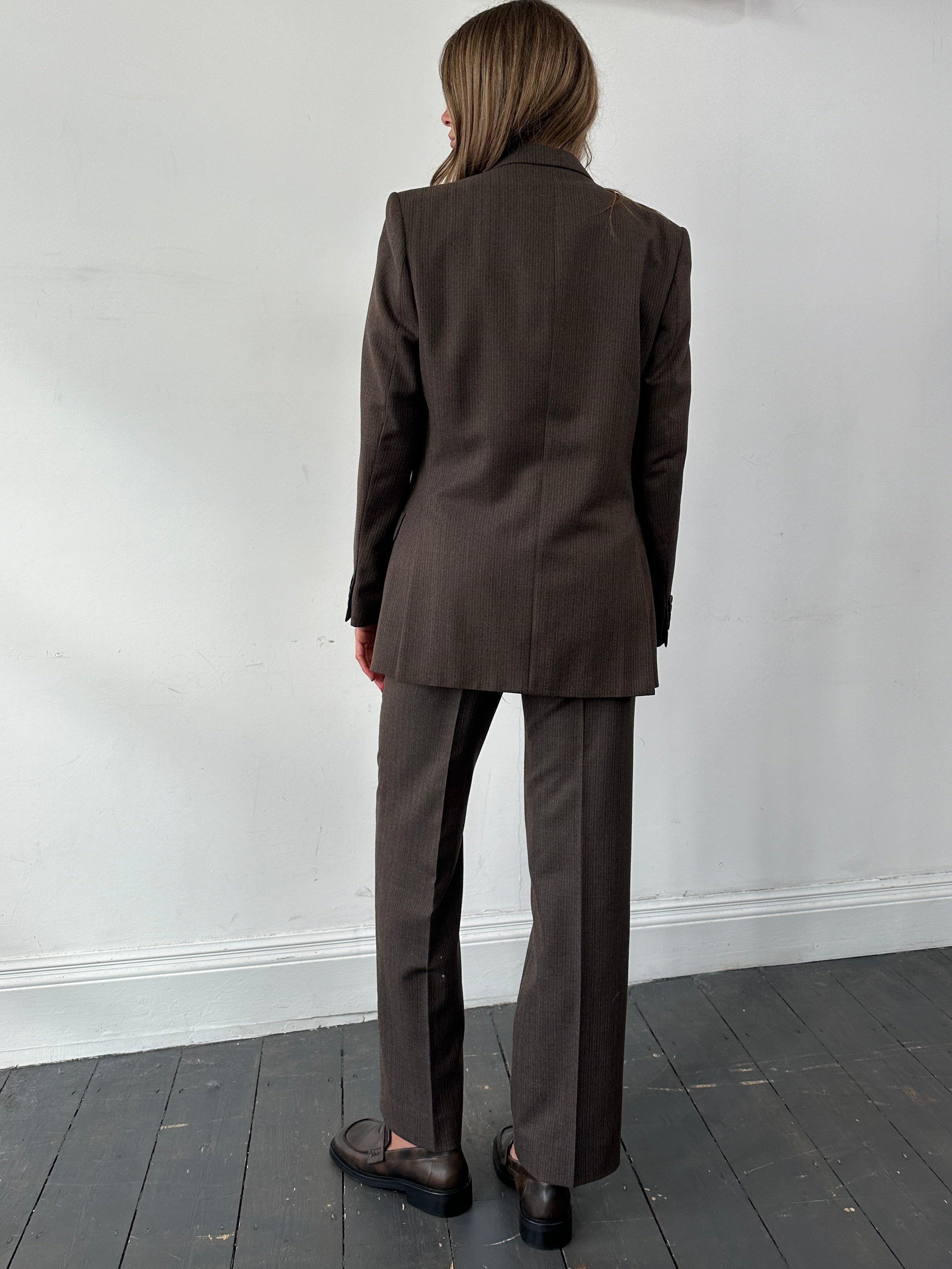 St Michael men's pinstripe worsted wool single-breasted suit in size 38R/W30, displayed as a stylish jumpsuit on a hanger.