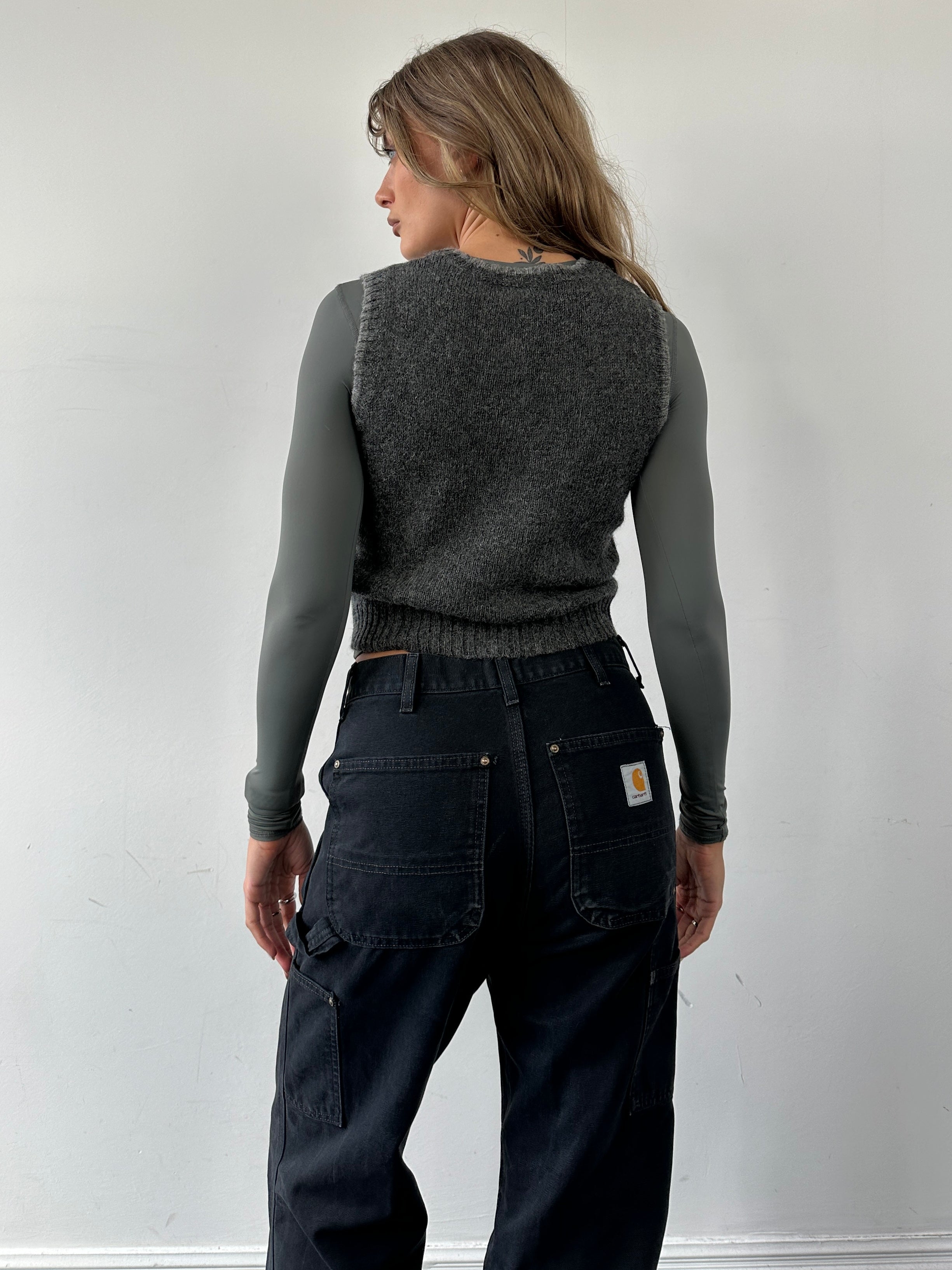 Vintage pure Shetland wool sleeveless vest jumper, size small, with a classic textured knit pattern and neutral color.