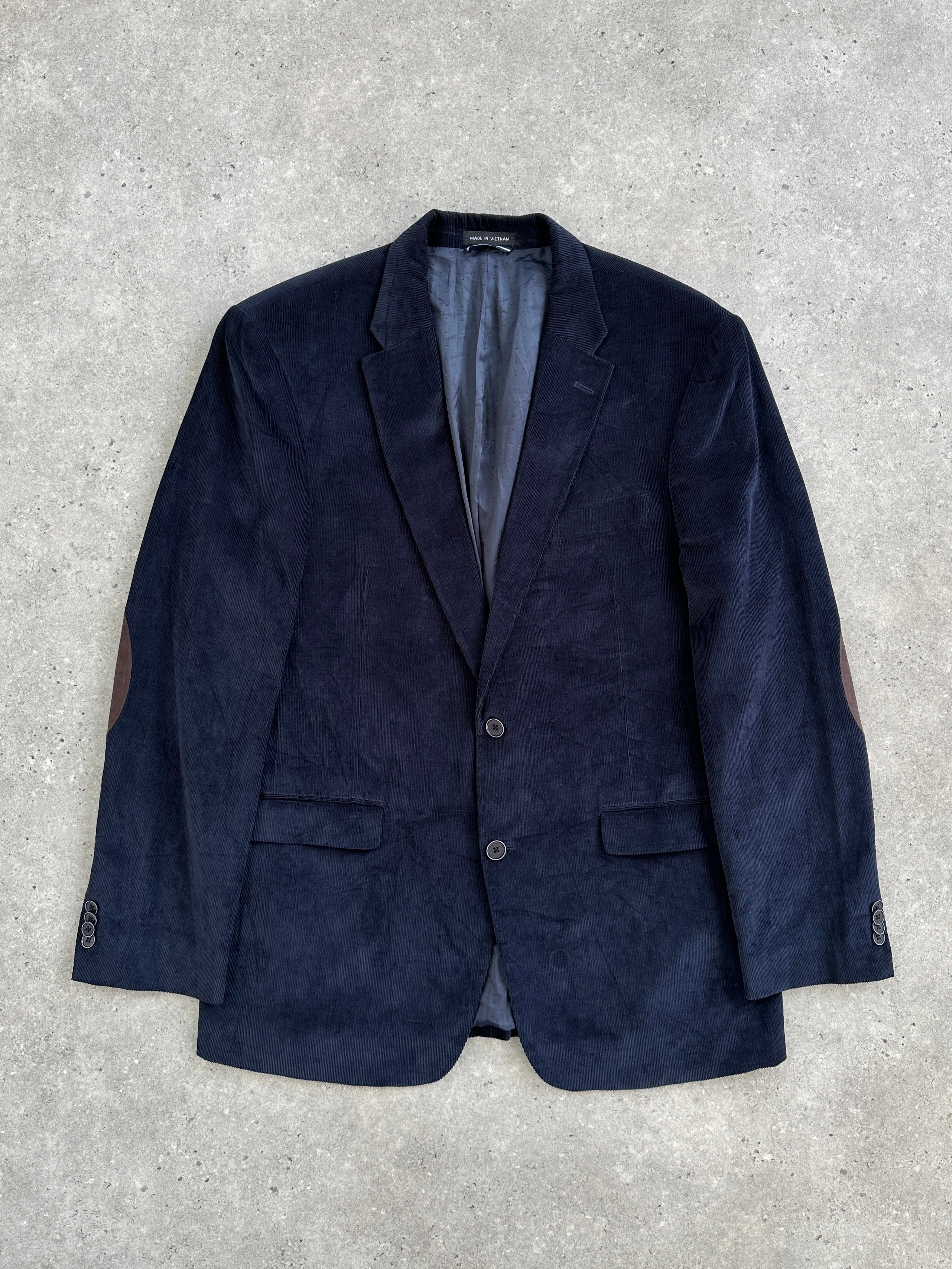 Tommy Hilfiger 2000s corduroy blazer in size 42L/XL, single-breasted design, dark blue color, showing collar and button details.