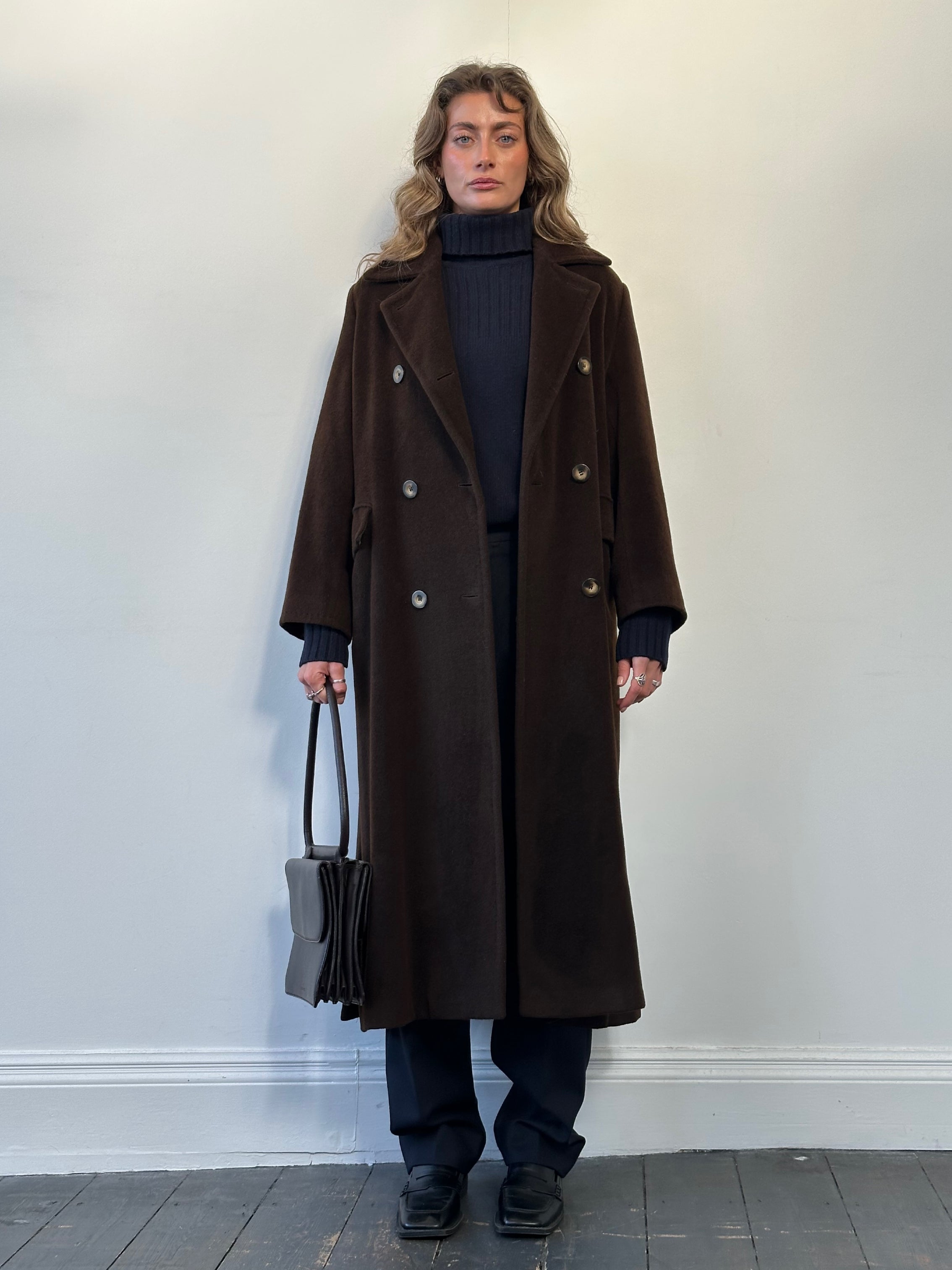Max Mara wool and cashmere double-breasted floor-length coat in size large, displayed hanging with a classic tailored design.