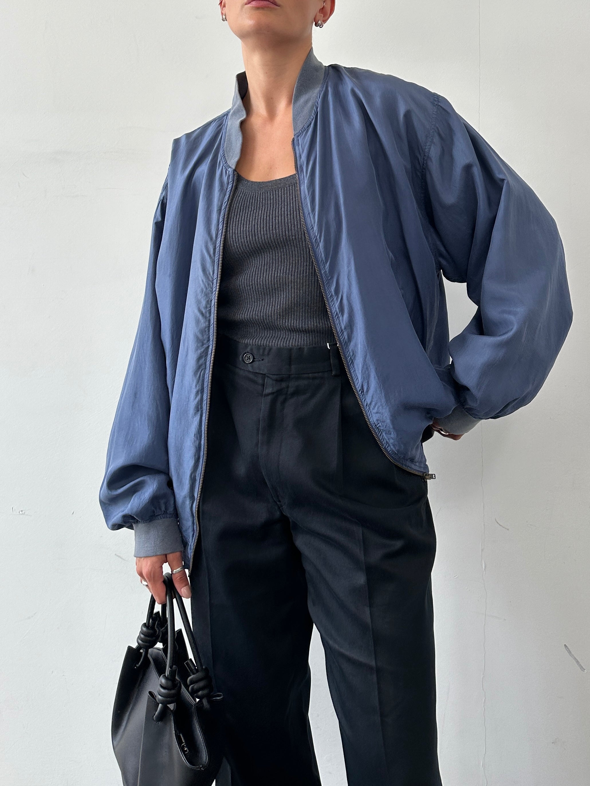 Vintage pure silk bomber jacket in XL, showcasing smooth fabric and classic style with a sleek collar and fitted cuffs.